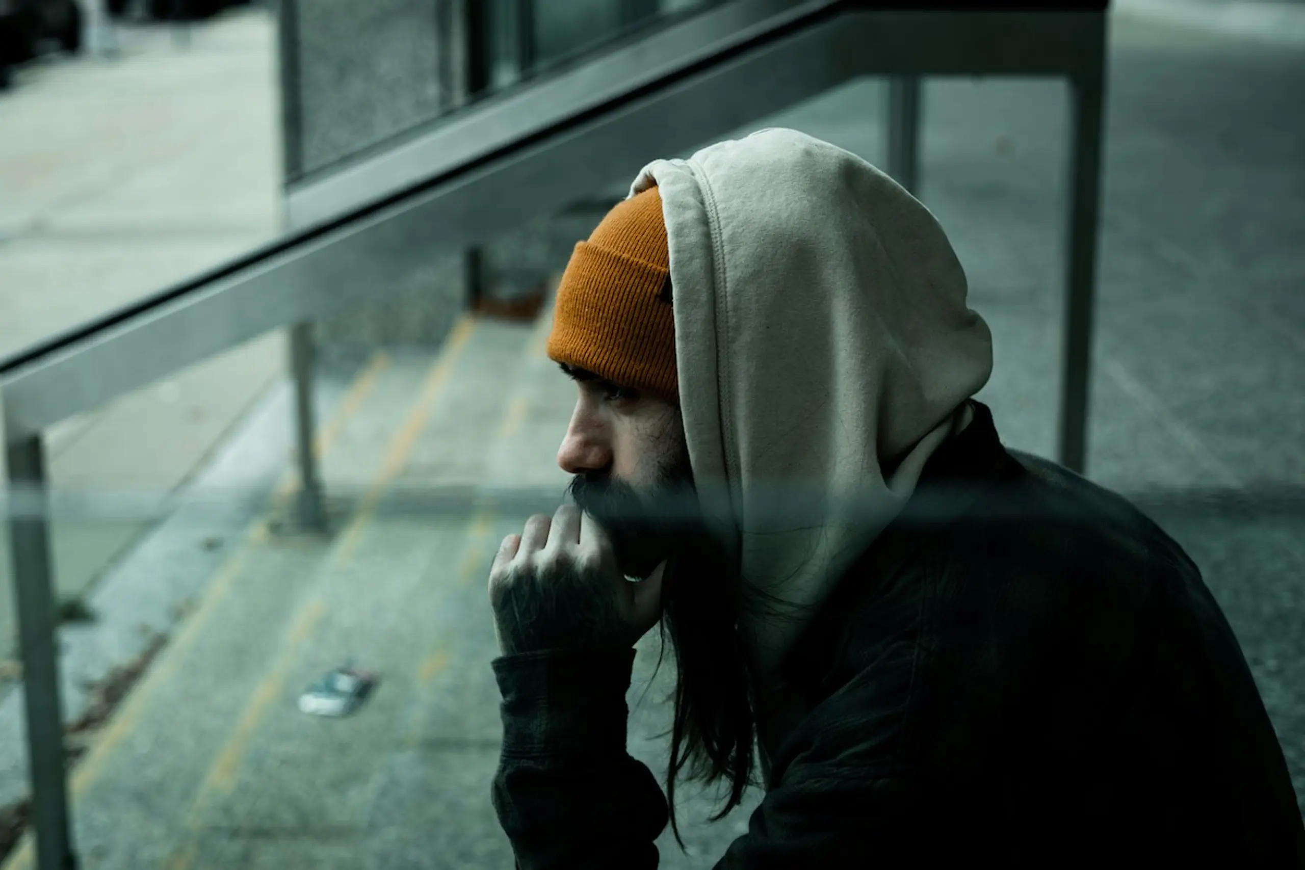 A cold man thinking on the steps
