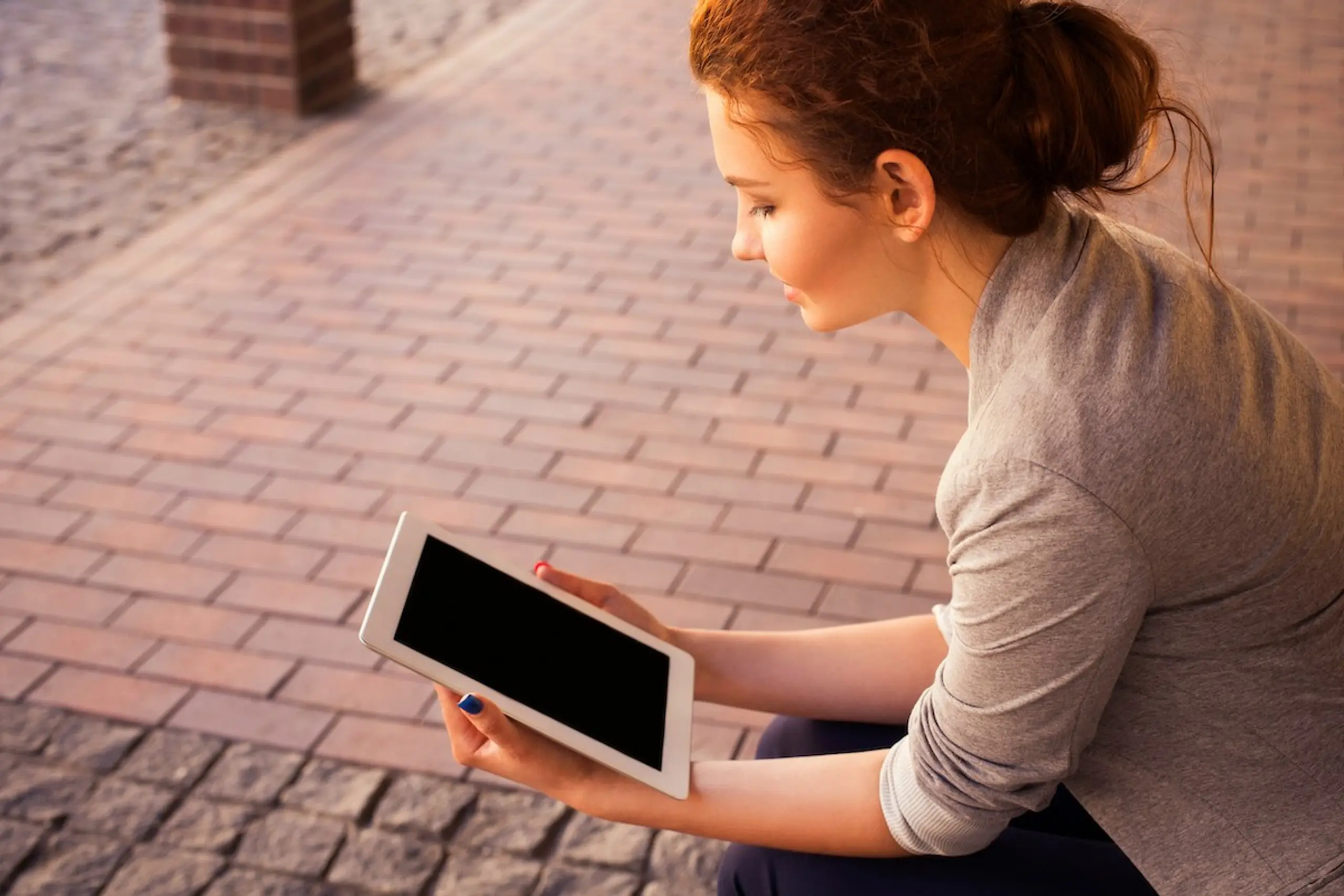 A woman reading on her ipad