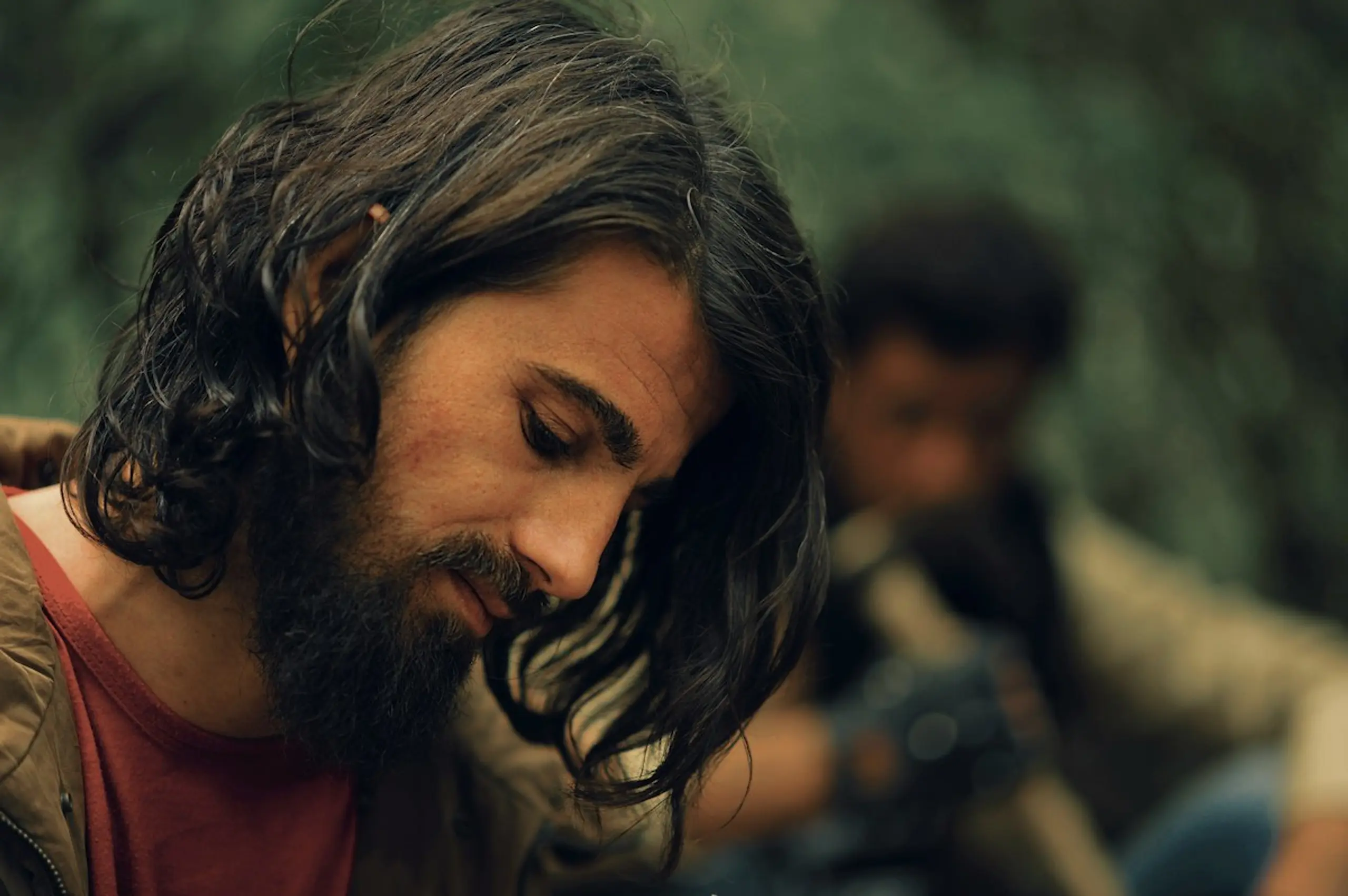 A man looking down in distress