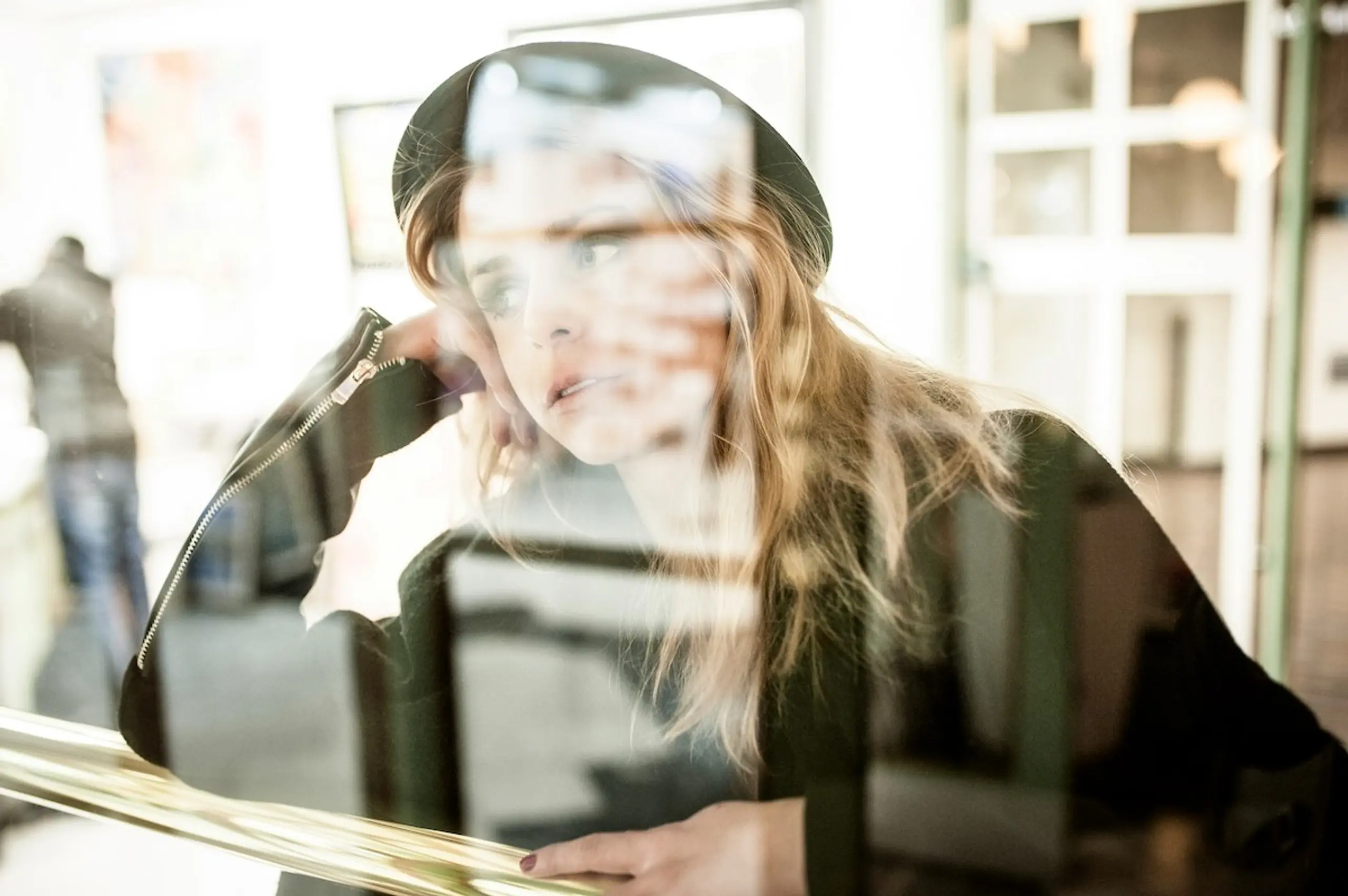 A stressed woman looking out of the window
