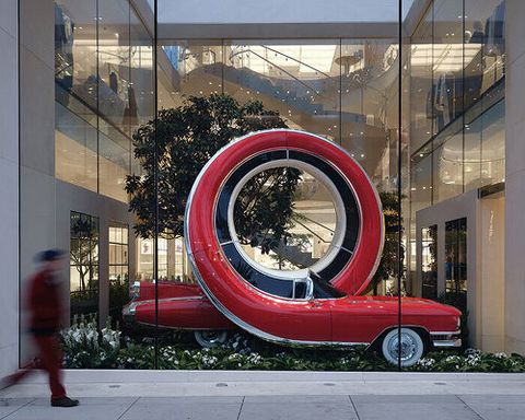 alex chinneck twists NYC taxis and LA cars into storefront sculptures for dior