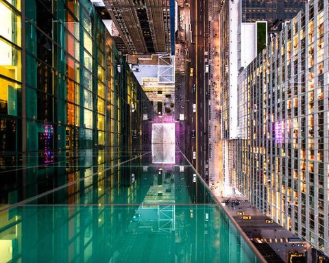 photo series distorts manhattan’s cityscape through fractured glass reflections