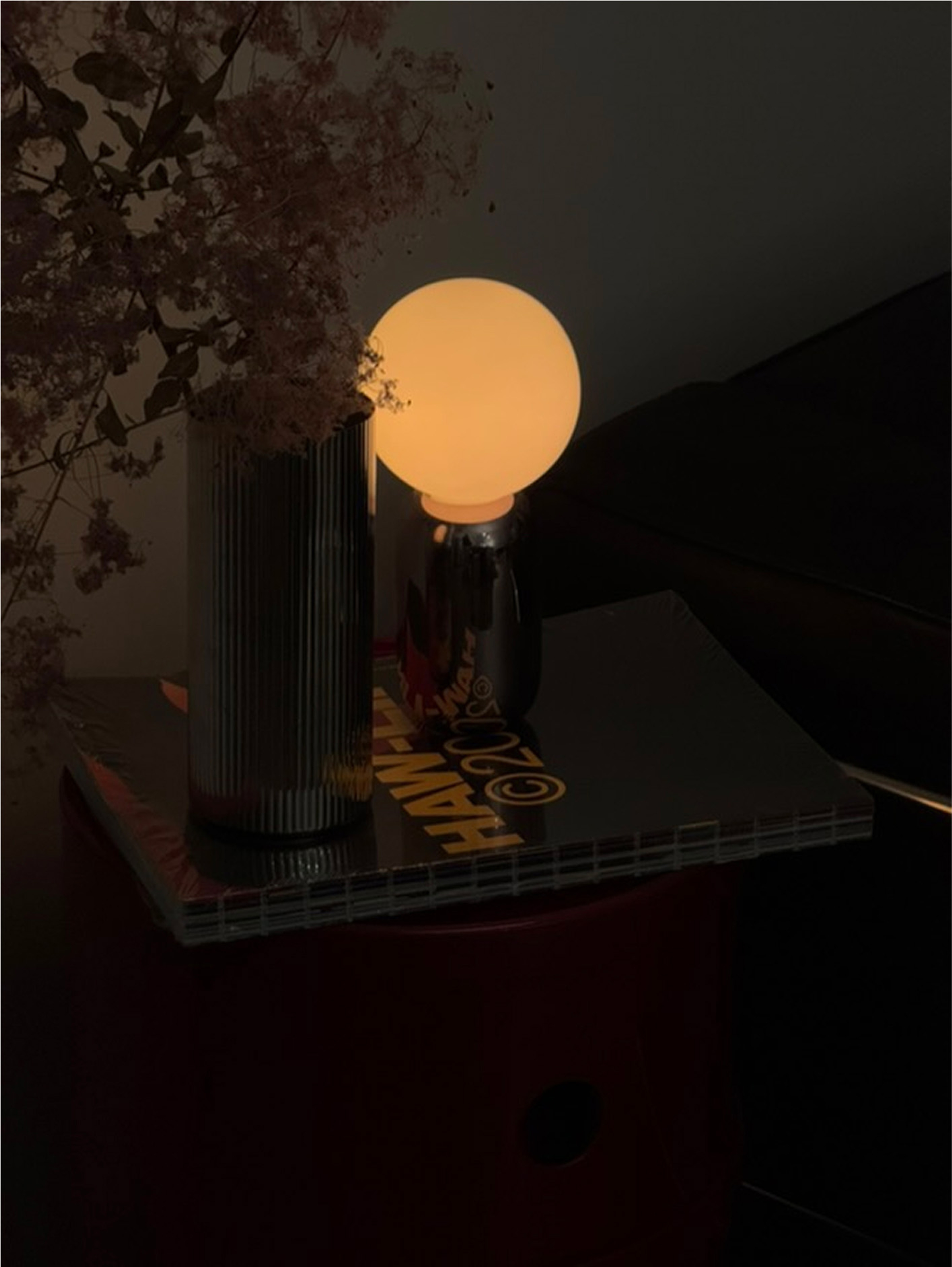 Bubble lamp in silver on side table