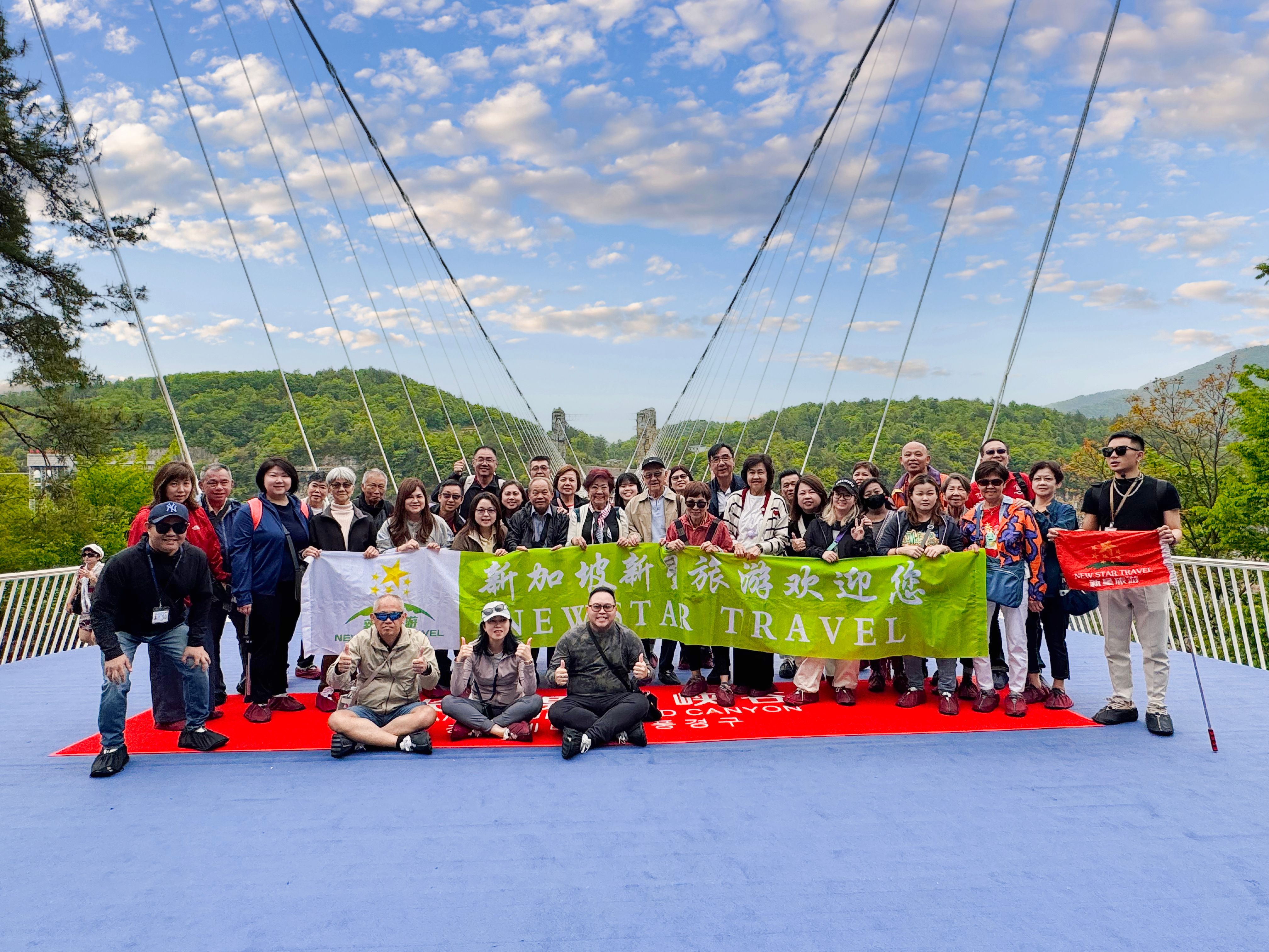 Walk on the world's longest and highest Glass Bridge over Zhangjiajie Grand Canyon, experiencing the heart-pounding thrill of being suspended 300 meters in the air.