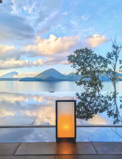 Embrace the serene beauty of Lake Toya, with snow-capped peaks and tranquil waters.