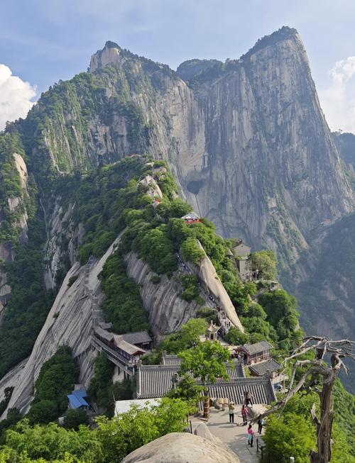 Climb Mount Hua, one of China’s five great sacred mountains, known for its steep cliffs and legendary hiking trails. 