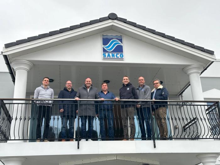 A photo of the teams from Metizoft and Sanco Shipping on the balcony of the Sanco headquarters. Pictured: Fredrik Muren, Sindre Lia and Øyvind Sundgot from Metizoft, and Tommy Bøe, Rudy Amundsen, Sigurd Helsem Sævik and Ivar Slettevoll from Sanco.