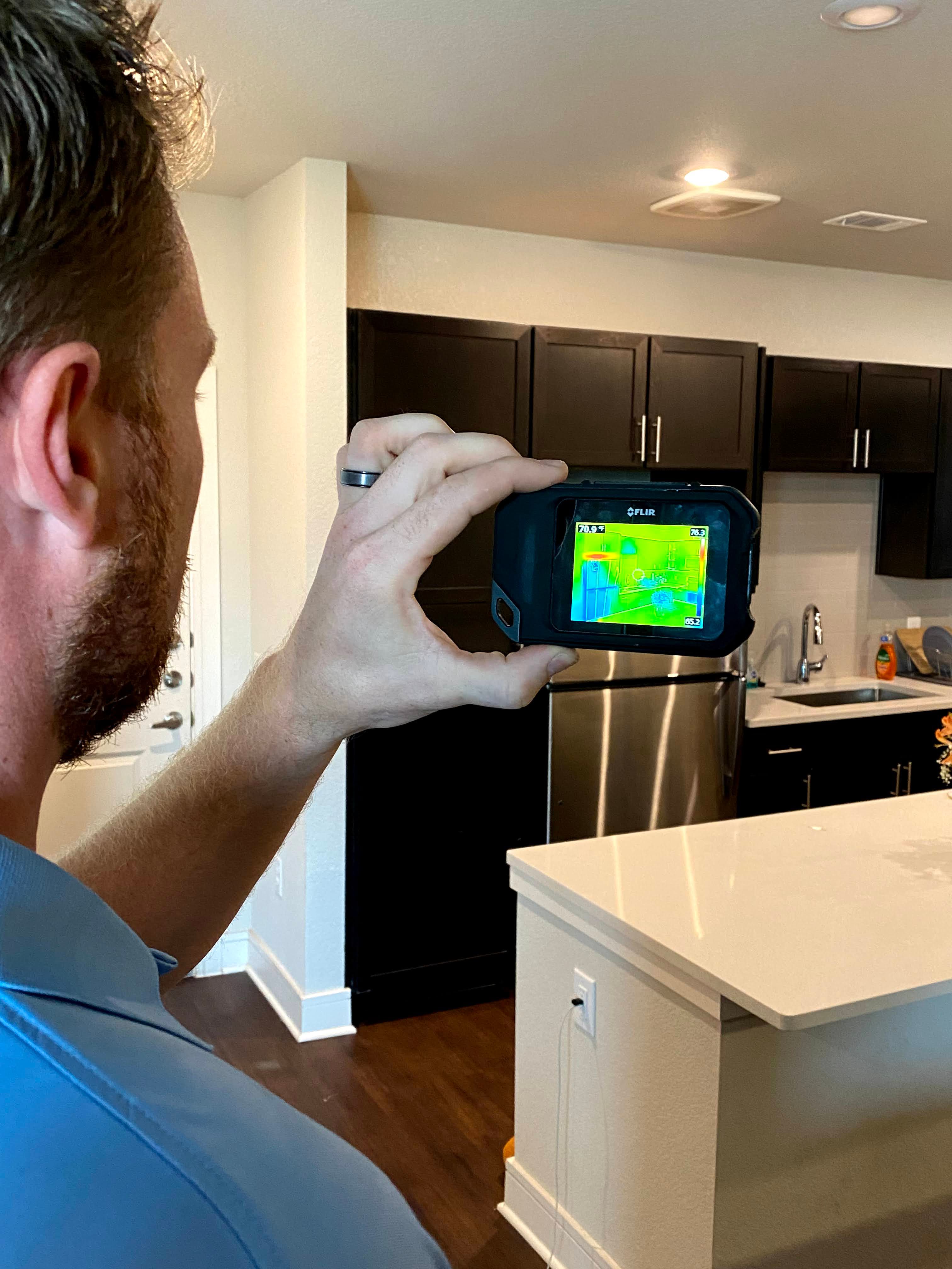 Noble Property Inspections team using drone technology for roof inspection