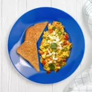 A plate with Egg Bhurji and a side of toast