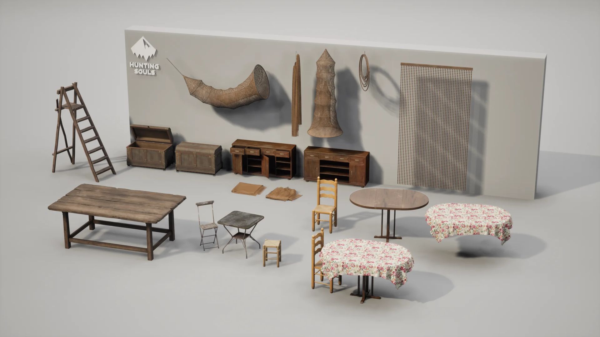 Line-up of rustic furniture props: wooden ladder, chests, sideboards, tables with floral cloths, chairs and wicker fish traps