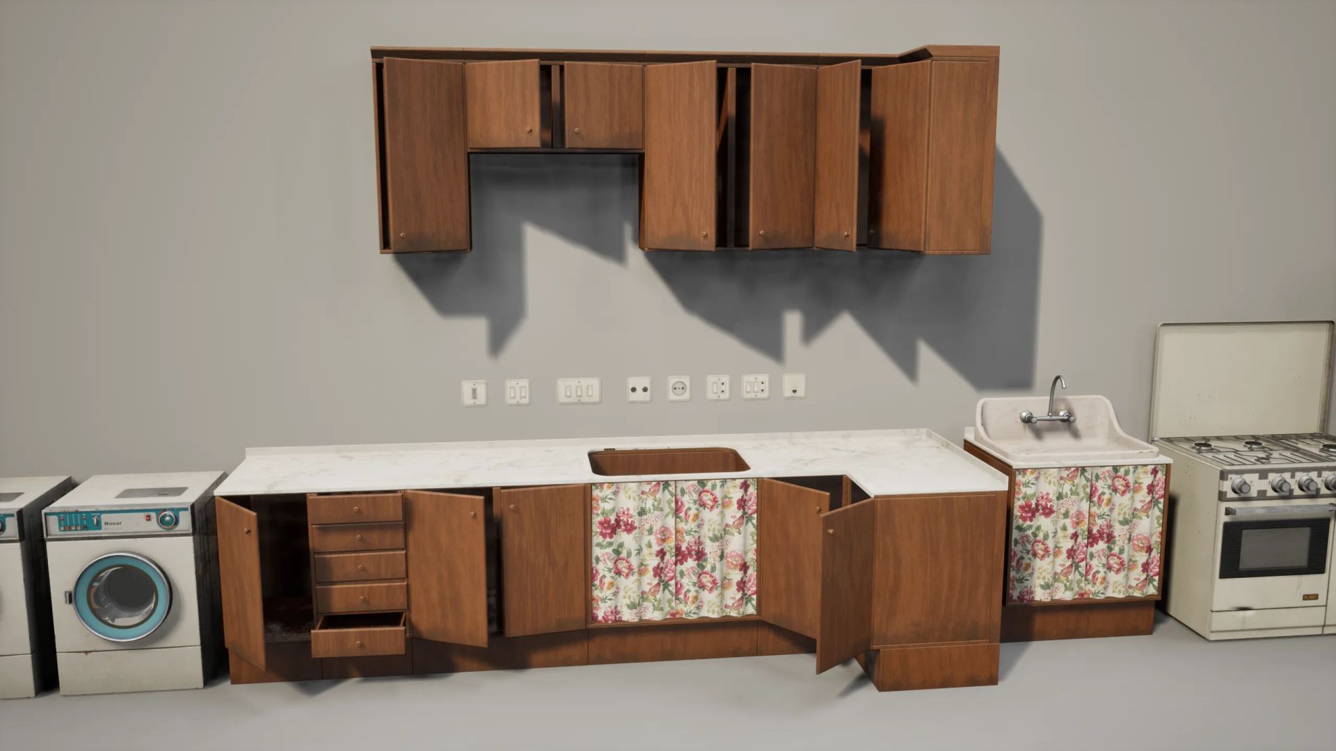 Close-up of wooden kitchen units with a floral curtain, washing machine, sink and stove