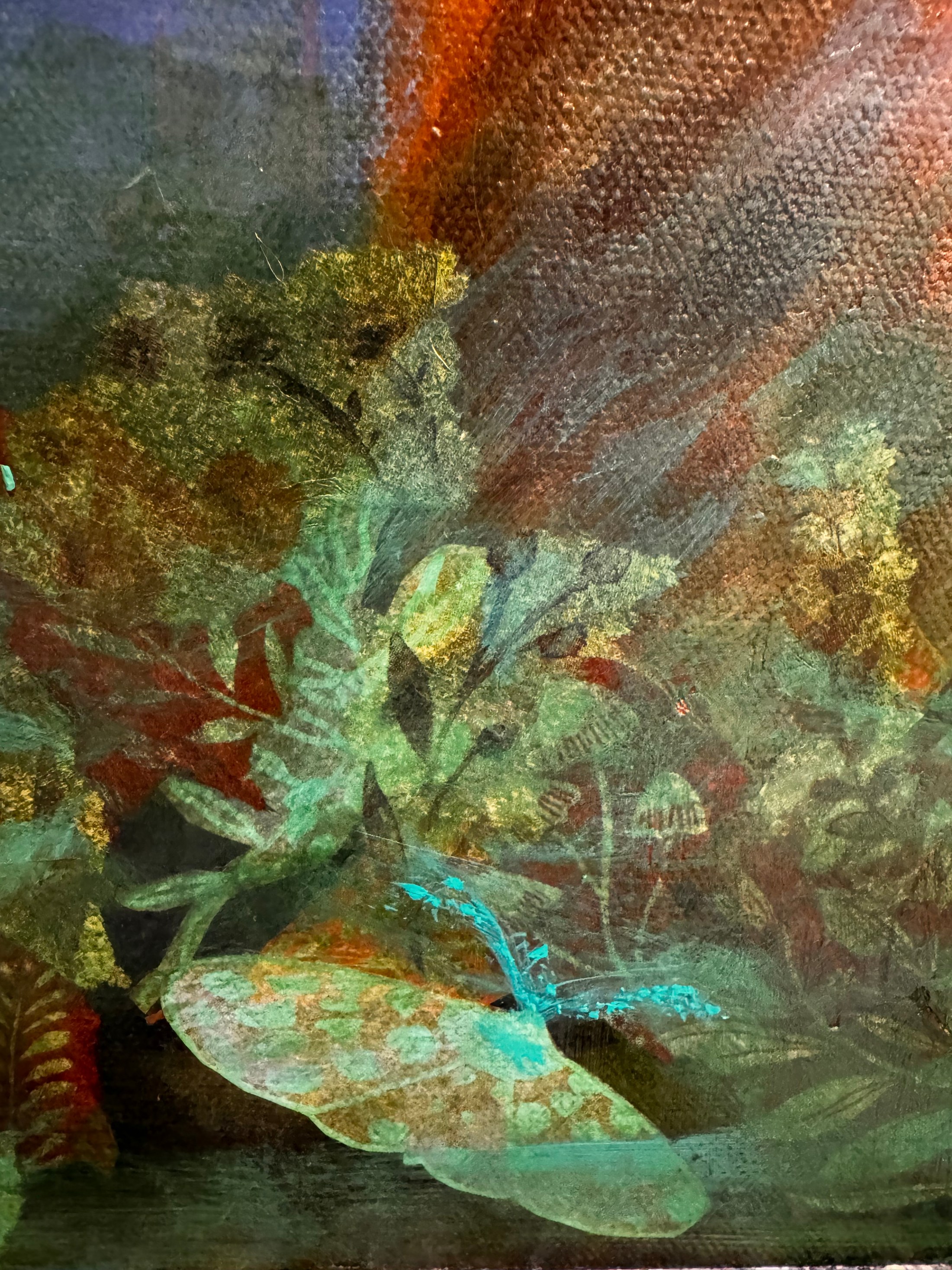 Large translucent dragonfly resting over shadowy green foliage beneath rust and blue abstract forms.