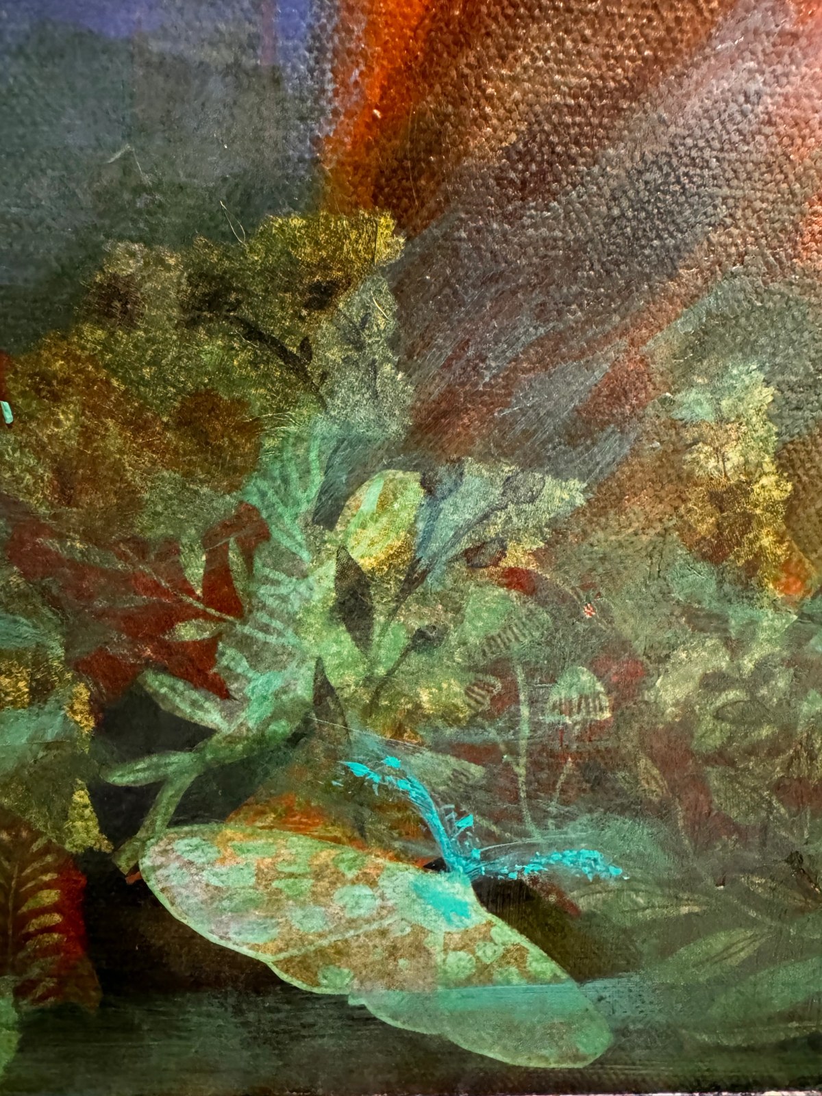 Large translucent dragonfly resting over shadowy green foliage beneath rust and blue abstract forms.