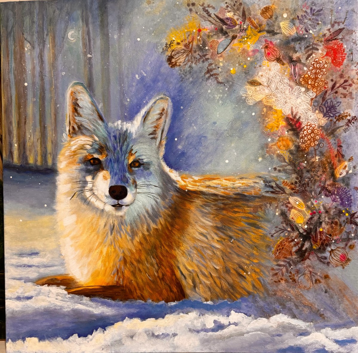 Red fox sitting in snow beside a vertical spray of orange, rust, and gray leaves.