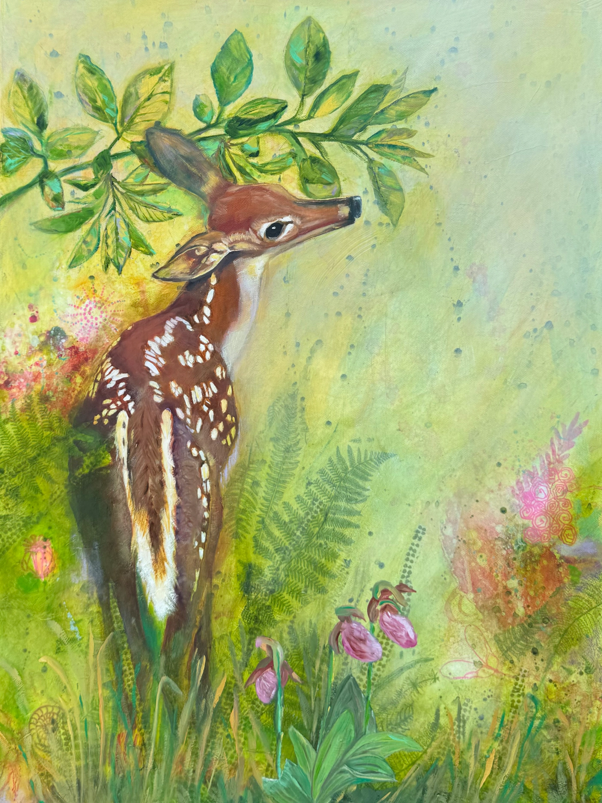 Joyful spotted fawn snuggled beneath leafy branches amid ferns and pink Lady Slipper flowers.