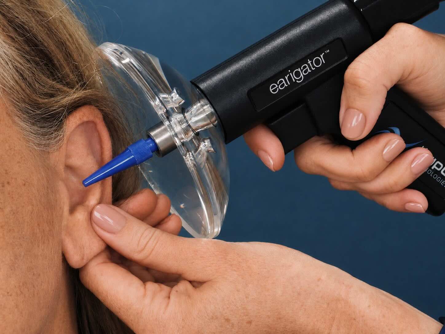 Dr. Paige Juarez using Earigator for earwax removal