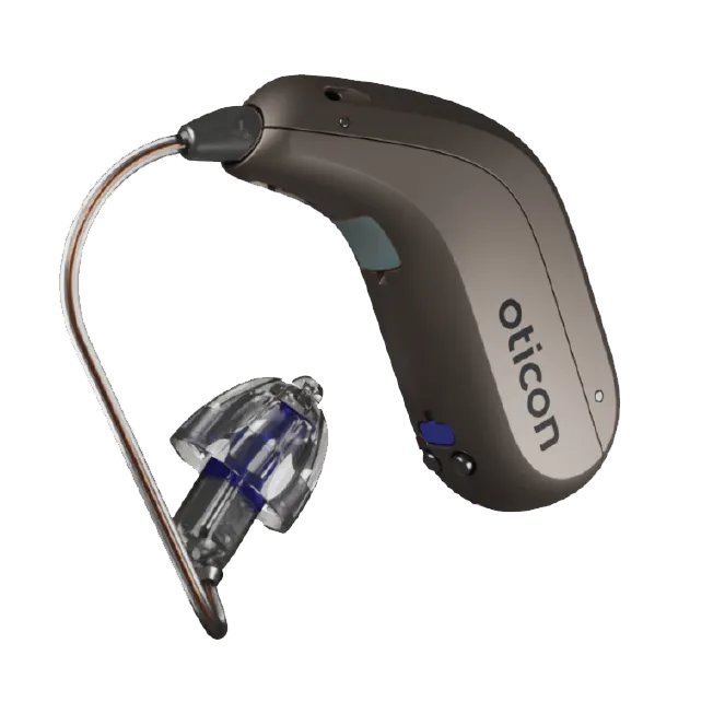 A behind-the-ear hearing aid being fitted over a patient’s ear at the Dripping Springs office