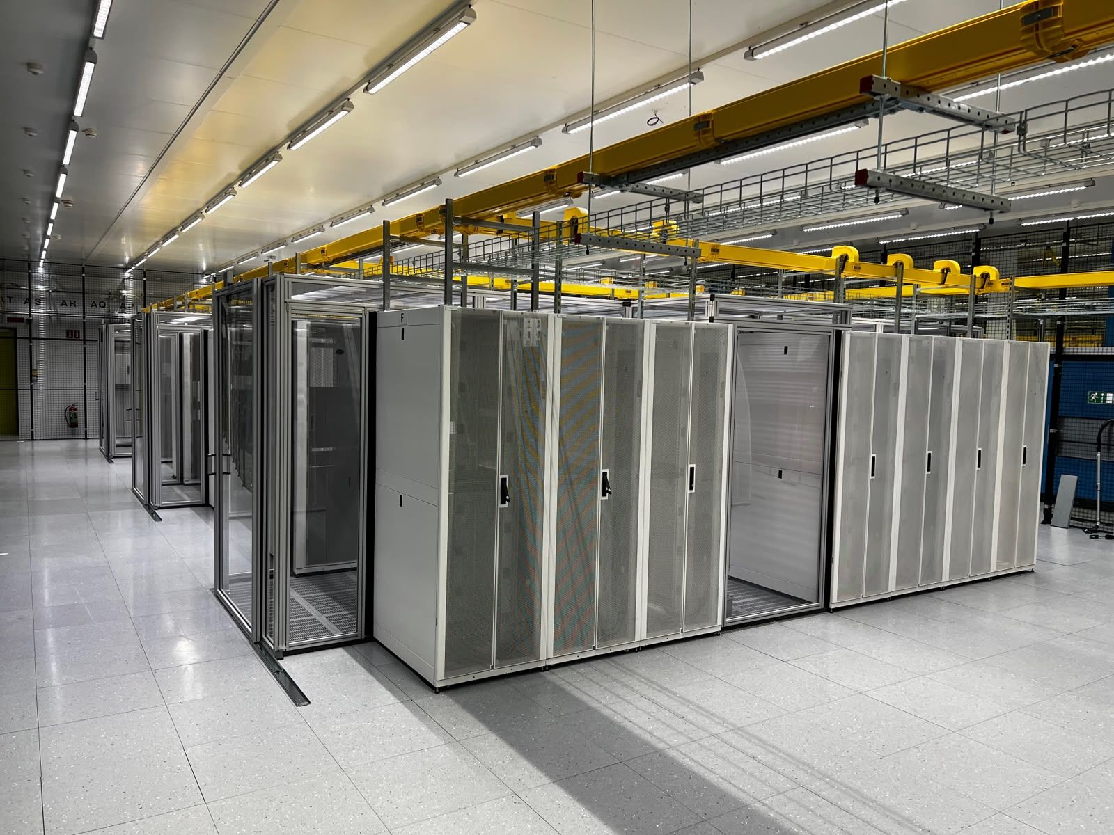 Row of racks with containment and cable trays
