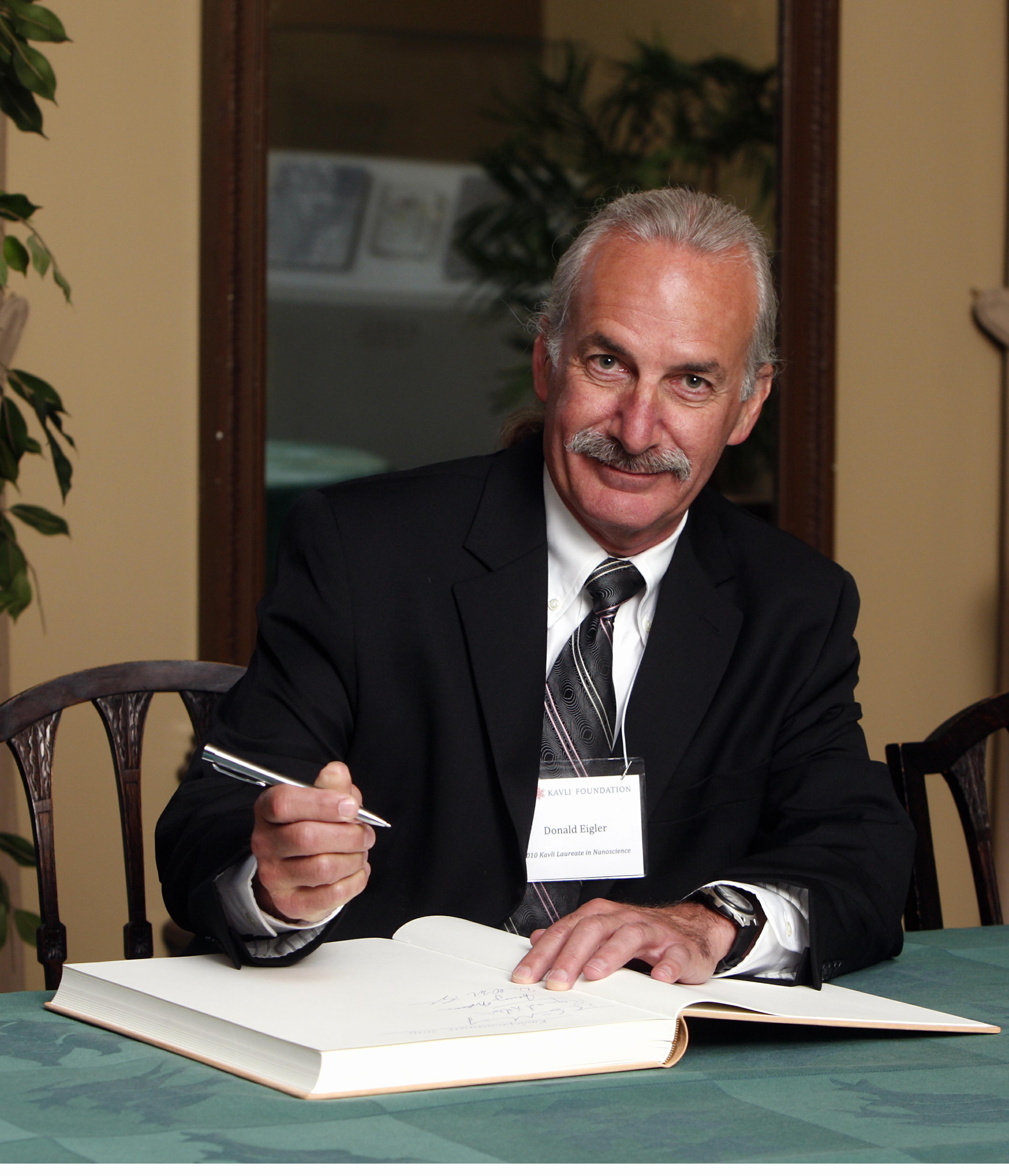 Donald M. Eigler signing the guest book 