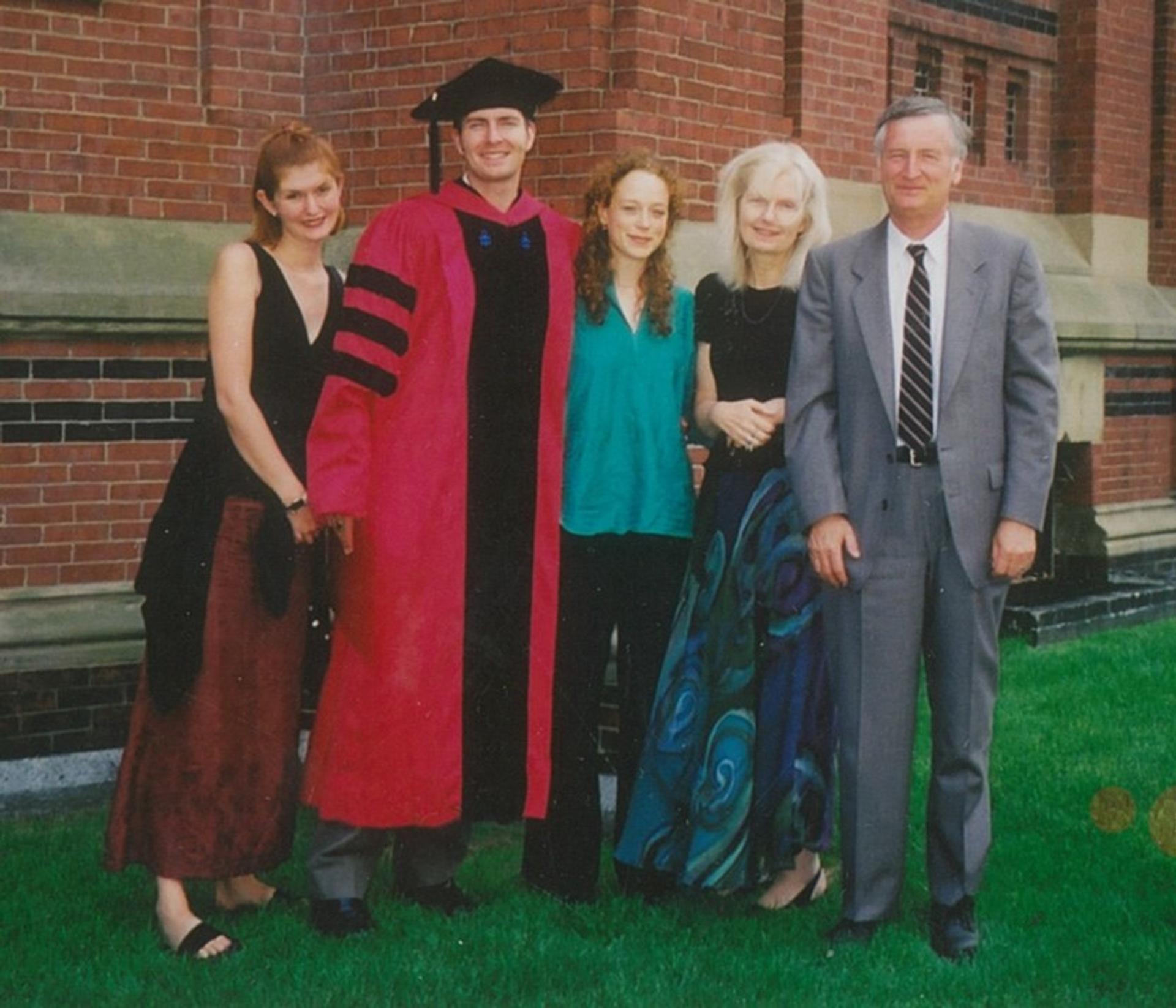 I received my PhD in Astronomy from Harvard. From left to right are my sister Christine, myself, Margaret Bourdeaux, and my mother and father.