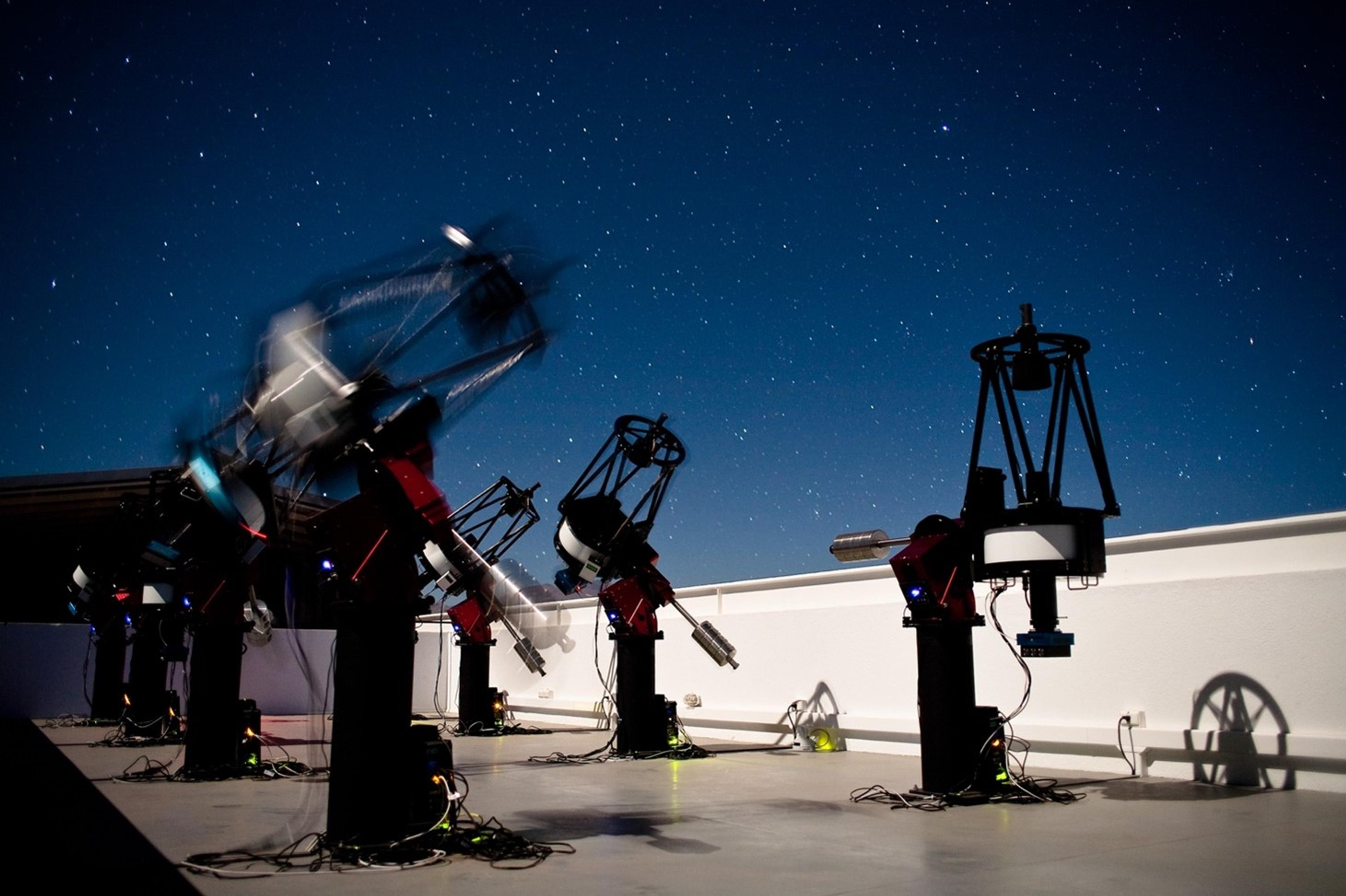 The MEarth Project consists of two sets of 8 telescopes each, one in Arizona and the other in Chile, that search for rocky planets transiting nearby small stars. (credit: Jonathan Irwin)