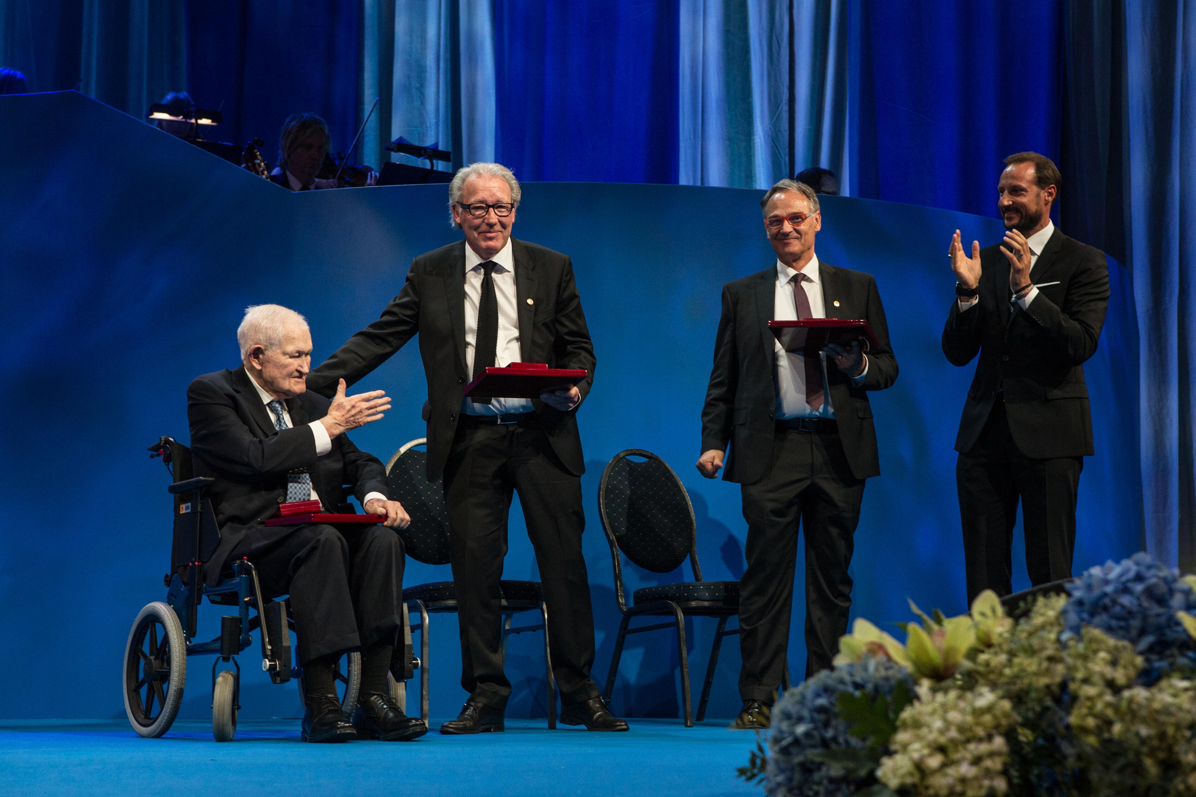 The three nanoscience laureates on stage at the ceremony in Oslo with their awards; from left: Calvin Quate, Christoph Gerber, Gerd Binnig and His Royal Highness Crown Prince Haakon 