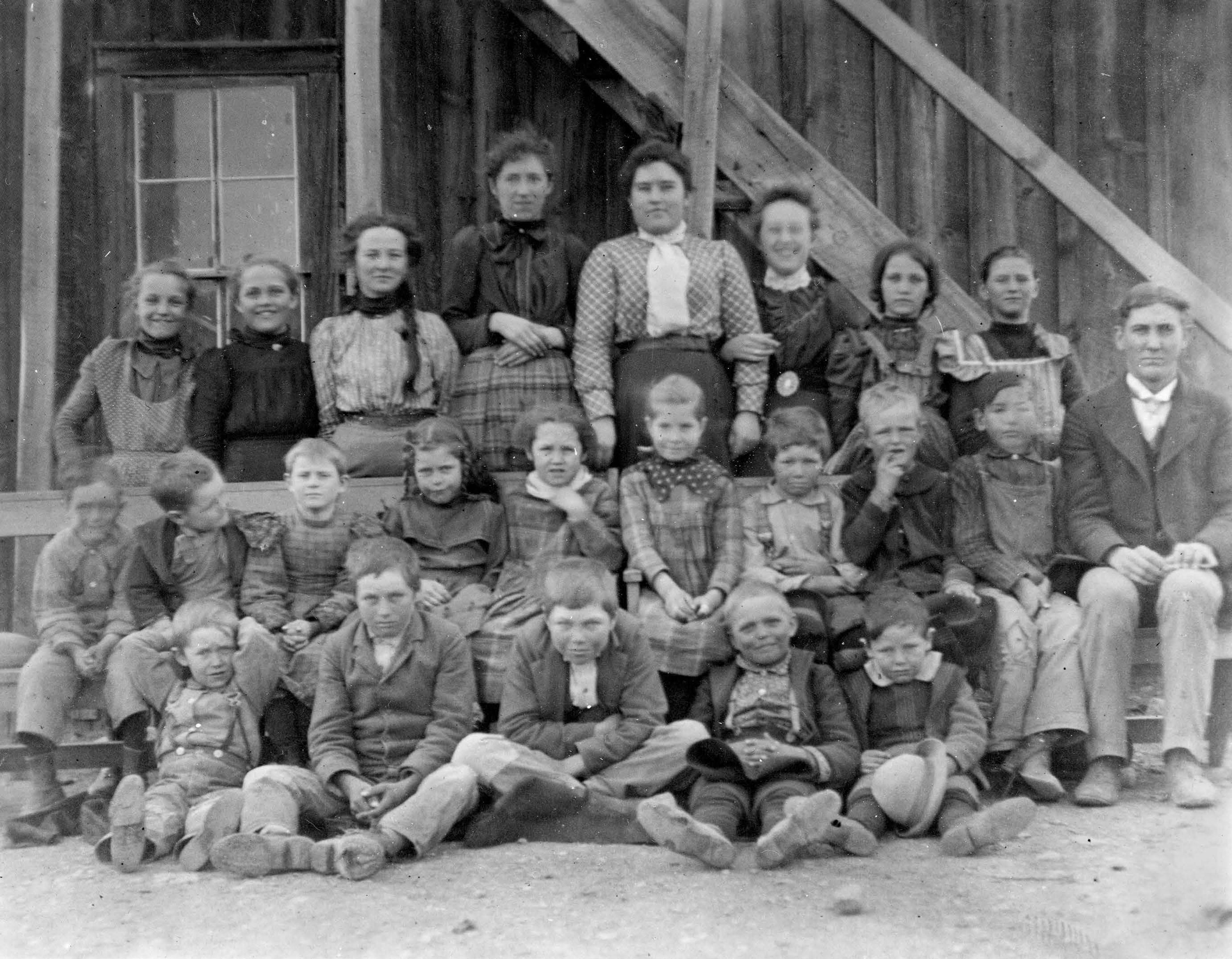 This is the class and one-room schoolhouse classroom which my maternal grandfather, Harvey, taught in the early part of the 20th century. Harvey is on the far right.