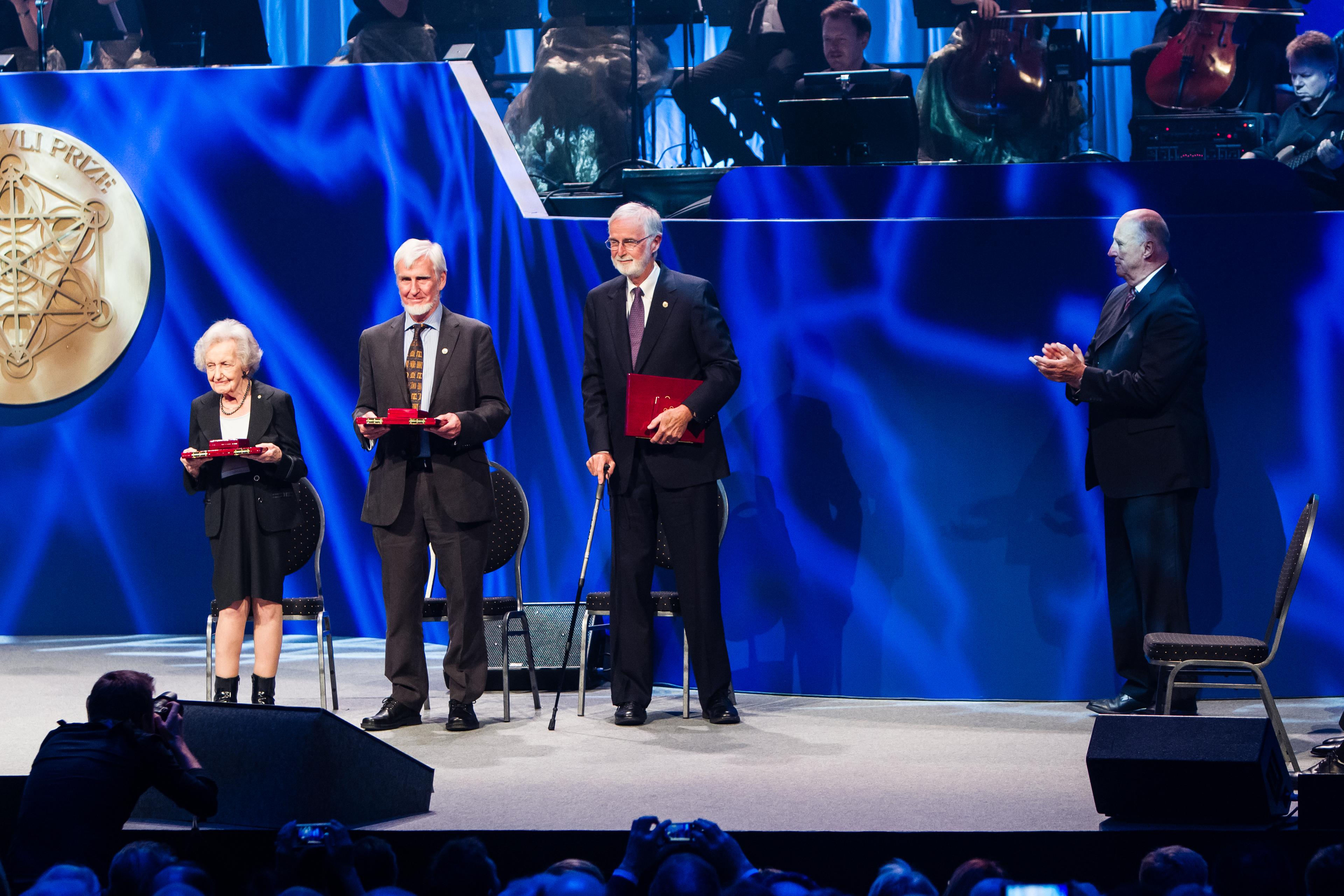 All three 2014 Kavli Prize laureates in neuroscience on stage at the ceremony is Oslo together with His Royal Highness King Harald. From left: Brenda Milner, John O'Keefe and Marcus E. Raichle 