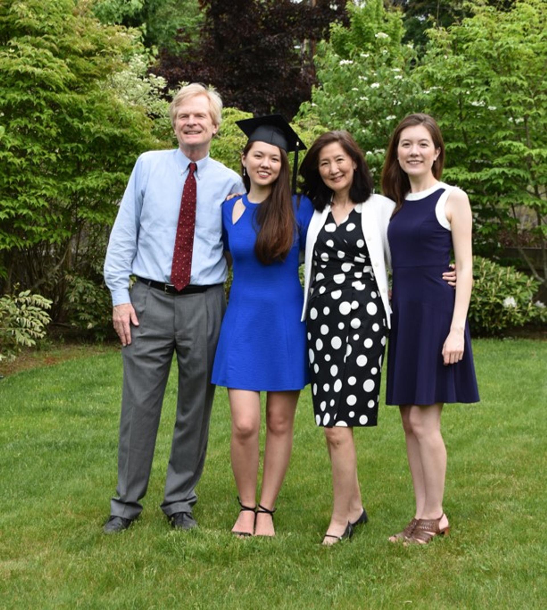 The Chen-Walsh family in 2020, celebrating our younger daughter’s backyard graduation from college during the pandemic, with her older sister. (picture courtesy of Stephanie Scanlon).