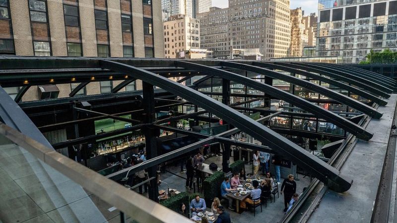 Rooftop event space at Versa with the retractable glass roof open above dinner tables