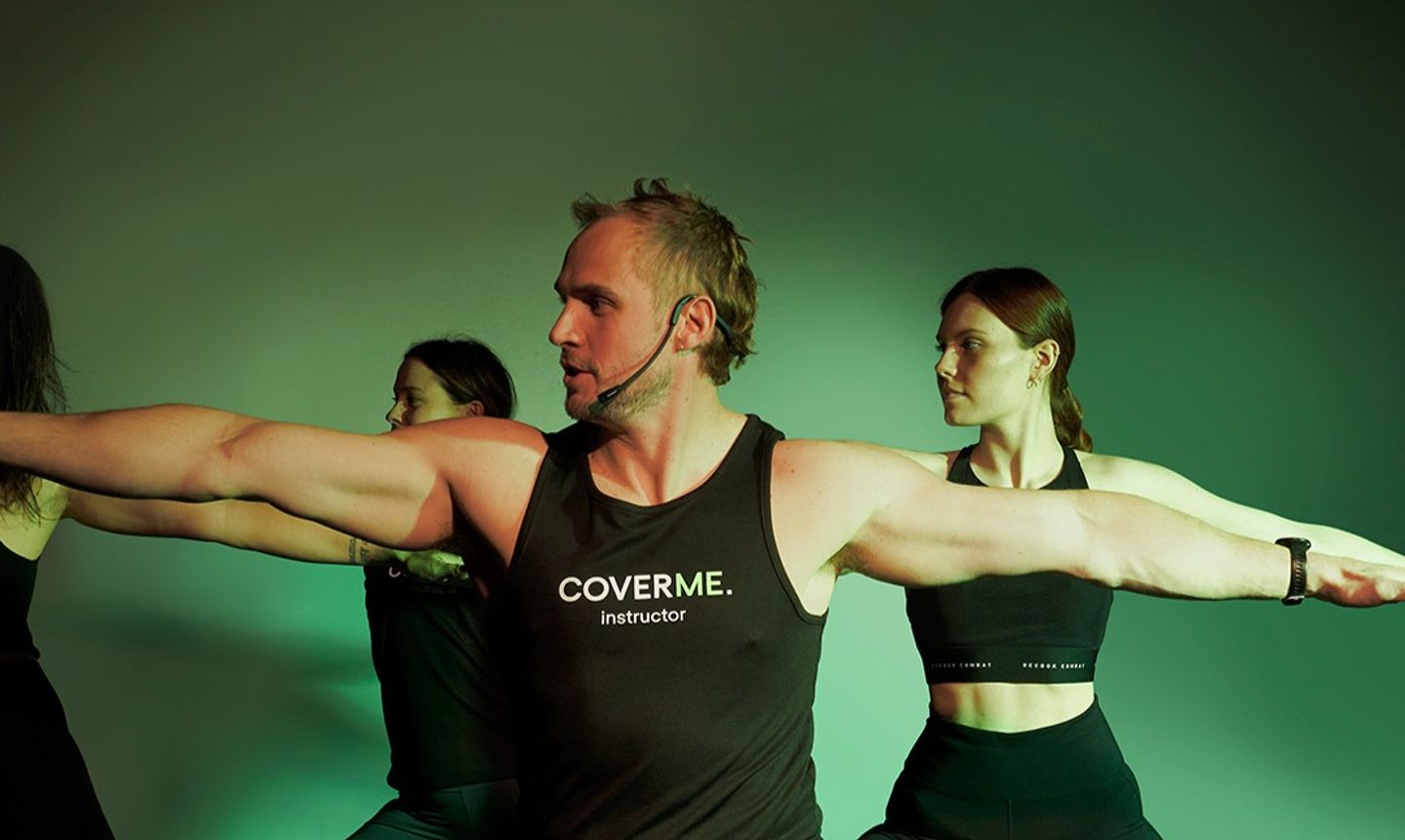 Three people practising yoga in a Cover Me photography shoot