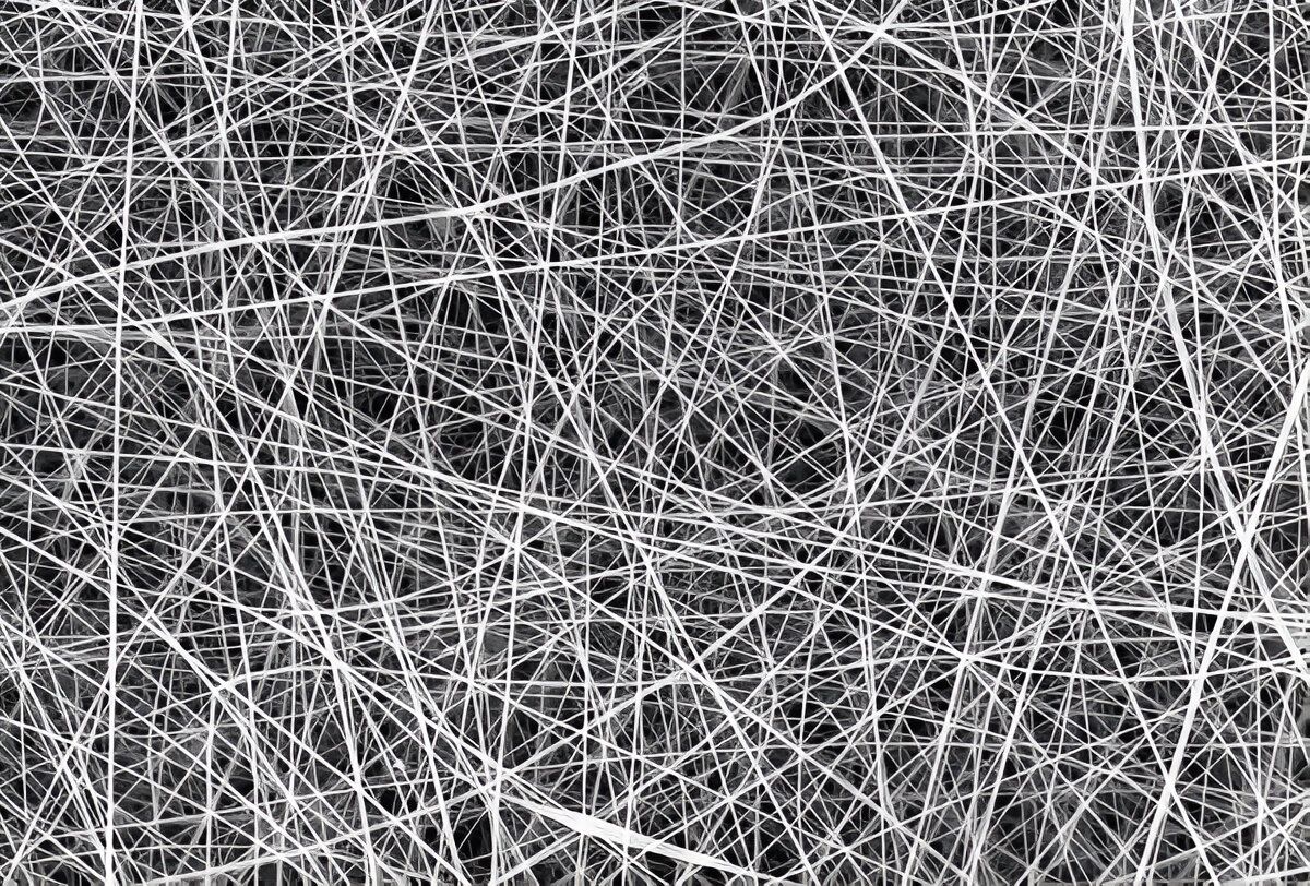 A detailed representation of electrospun nanofibers, illustrating their thin, elongated form and complex arrangement.