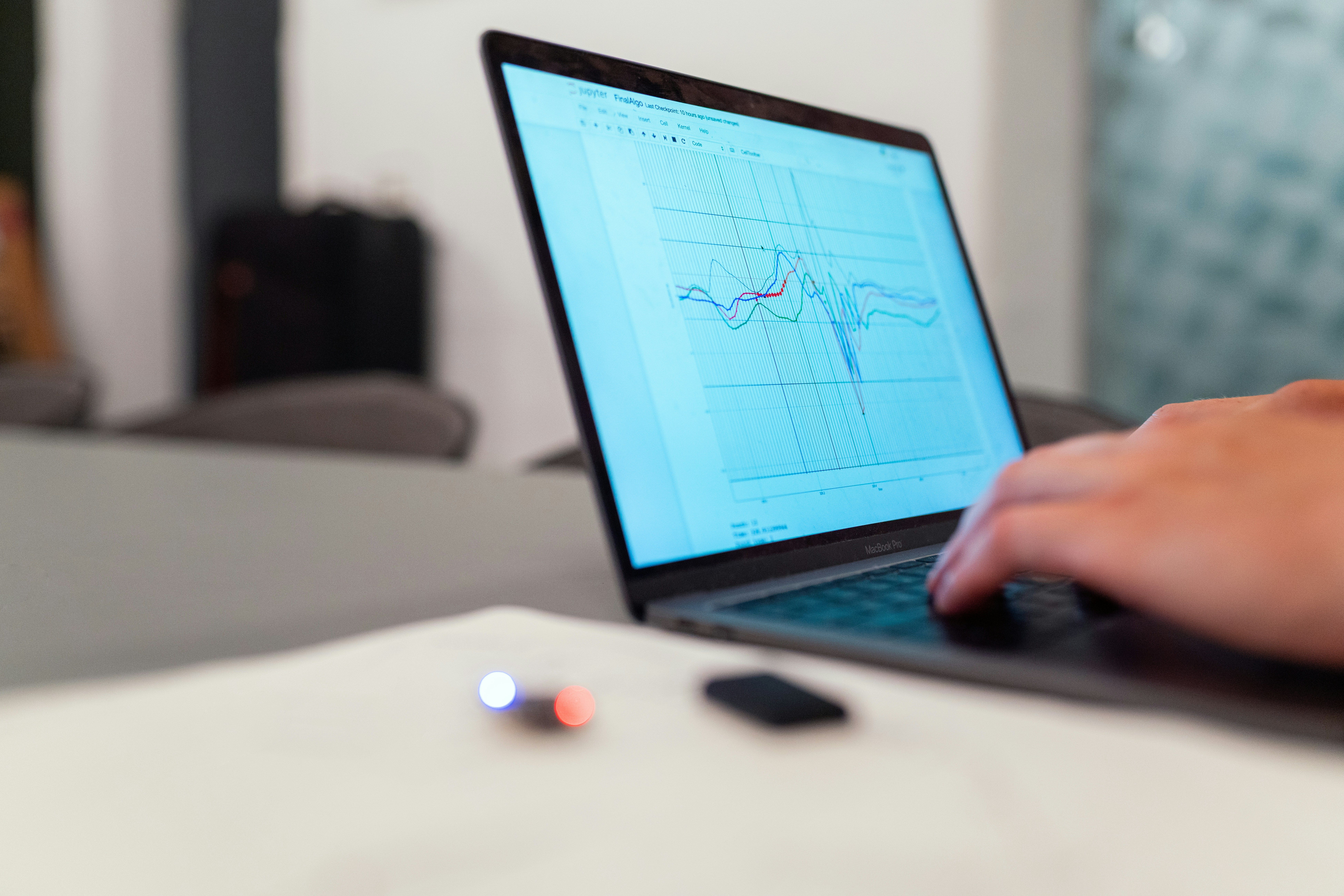 A person operating laboratory furnace software to automate temperature profiles for experiments. A person operating laboratory furnace software to automate temperature profiles for experiments.