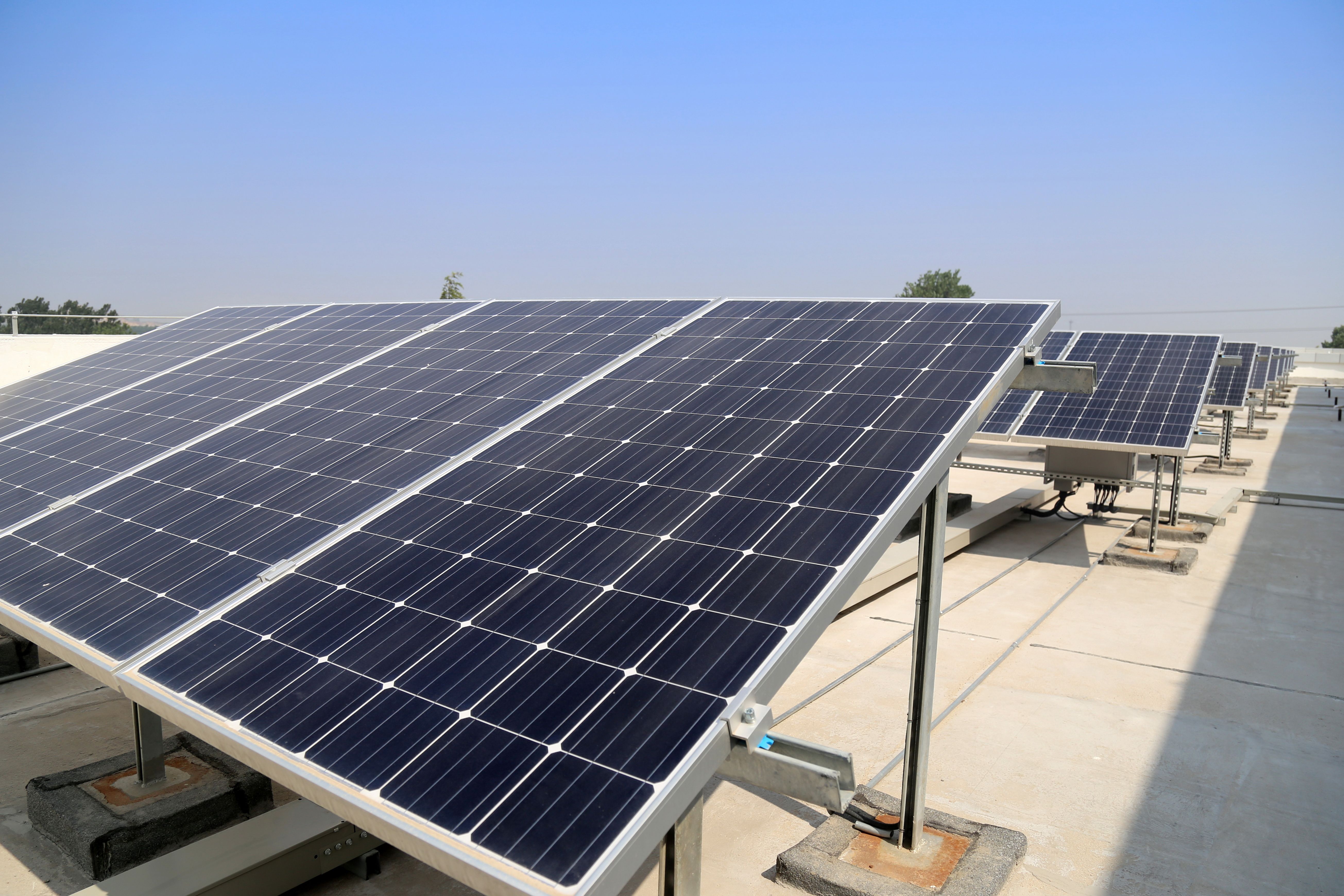 Image of solar panels that have utilized vacuum hot presses for the efficient bonding of materials in photovoltaic cells. Image of solar panels that have utilized vacuum hot presses for the efficient bonding of materials in photovoltaic cells.