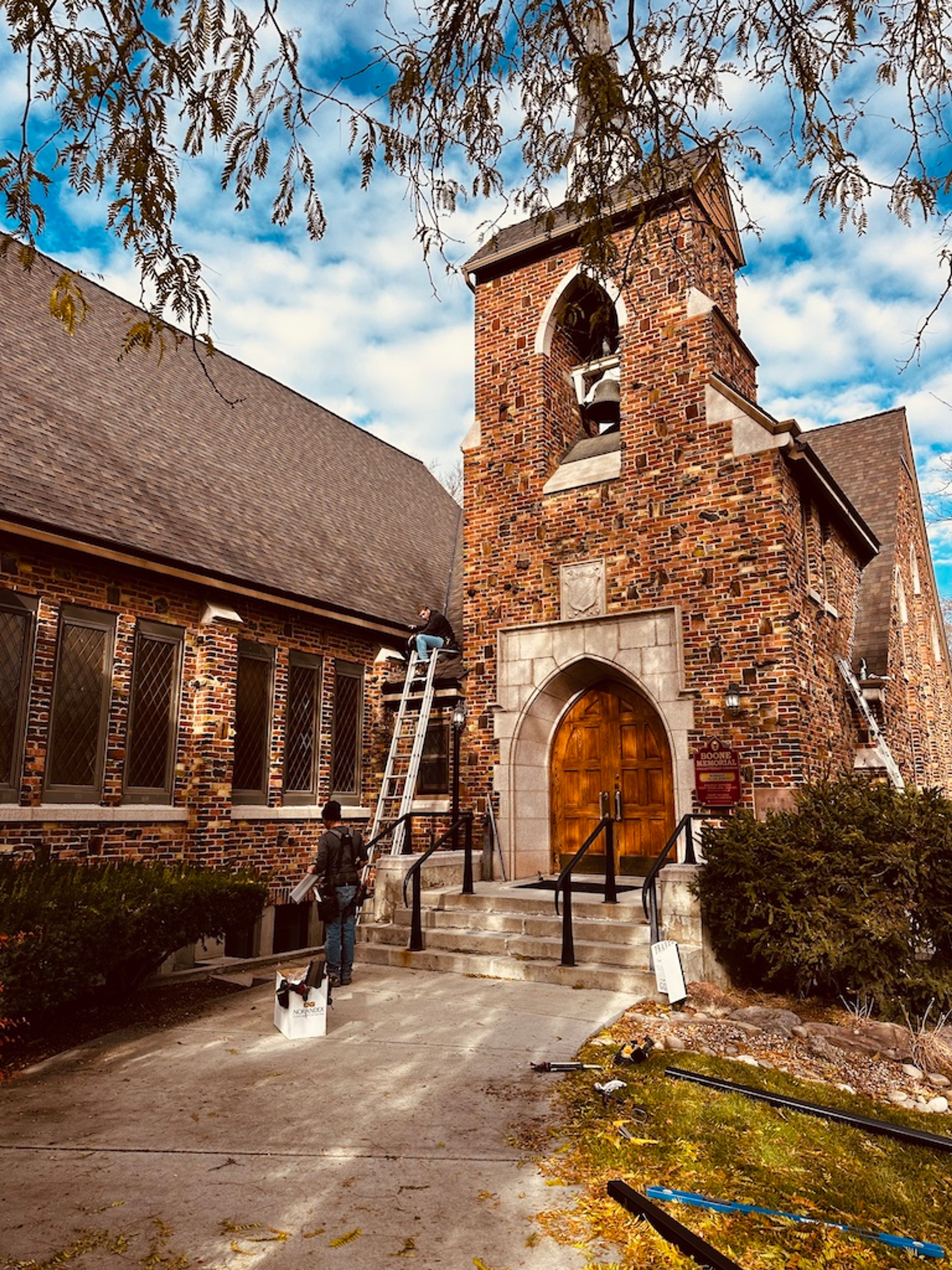 Idaho Seamless Gutter crew working at a historic stone church in downtown Boise