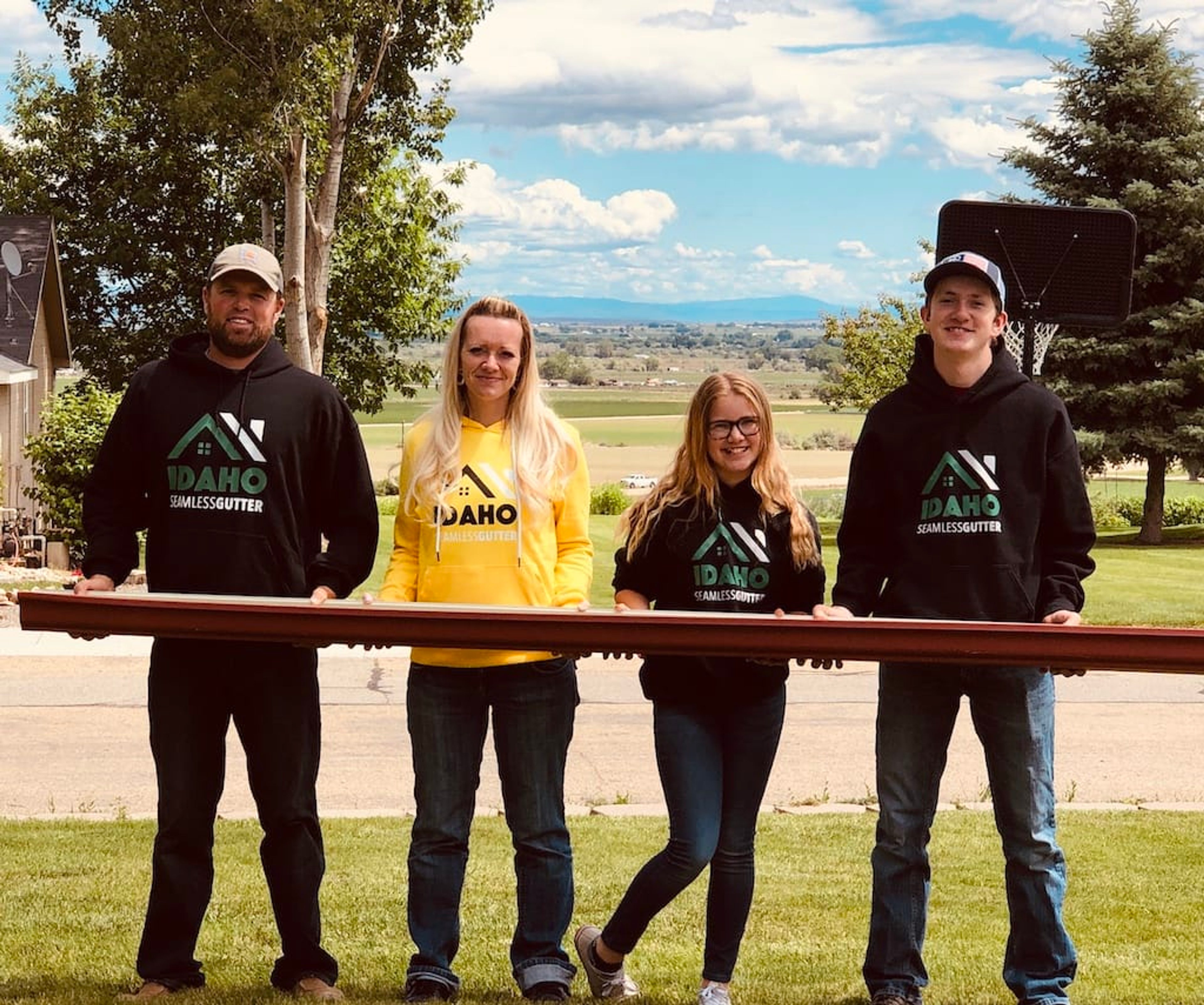 The Beers family holding a steel beam together on their property outside Boise
