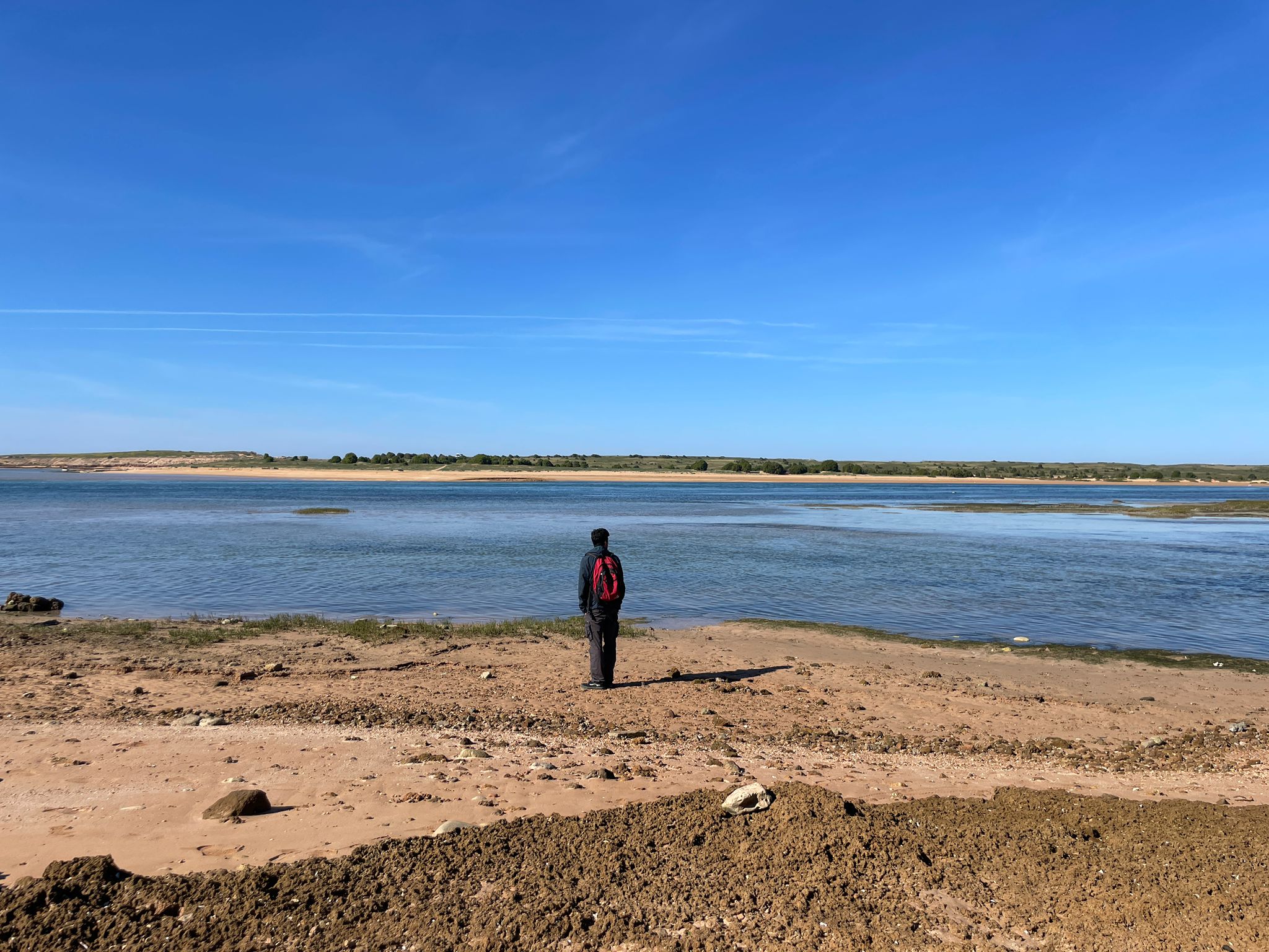 Ronald in a distance with the sea in a Morocco beach