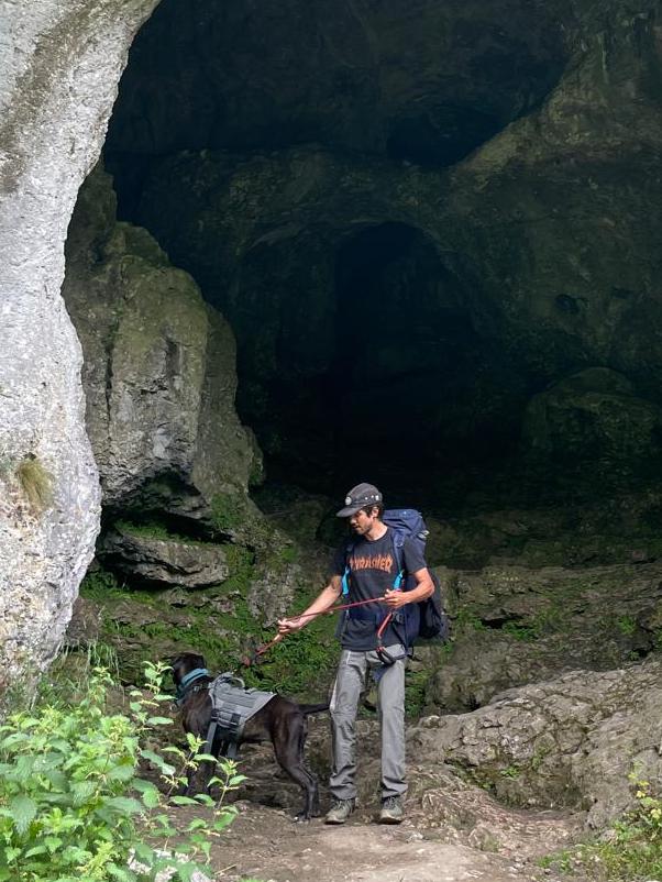 Ronald and Bagheera, his dog in a cave in the peak district