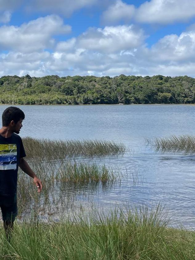 Ronald playing with Bagheera, his dog, in a lake in Brazil
