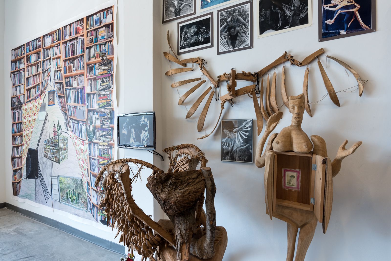 Different art sculptures and portraits displayed in a gallery space.