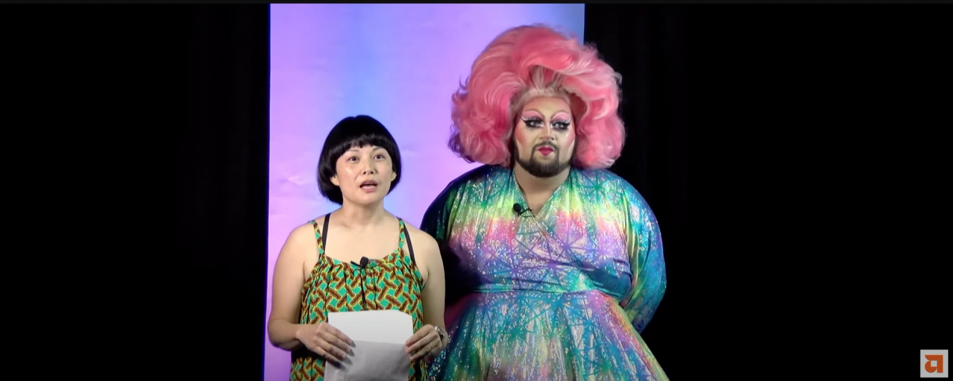 Anne Ishii and Eric Jaffe, a drag queen, stand next to each other 