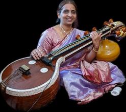 Musician Bhuvana Kannan sitting with her sitar.