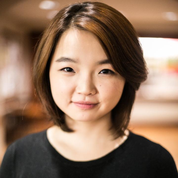 Headshot of Claris Park in front of a blurred background.