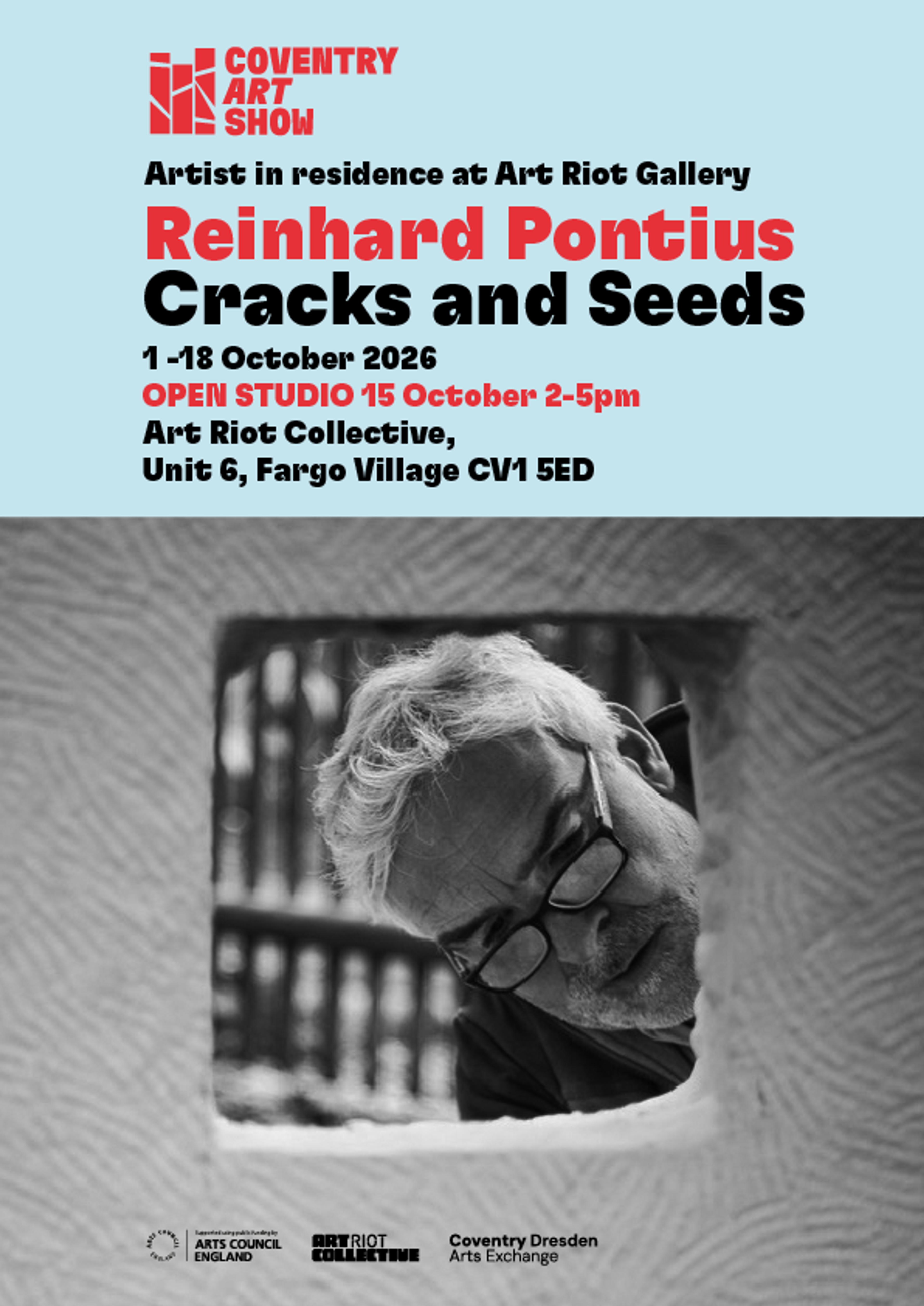 Blue text above a black‑and‑white photo of artist examining a textured sculptural artwork.