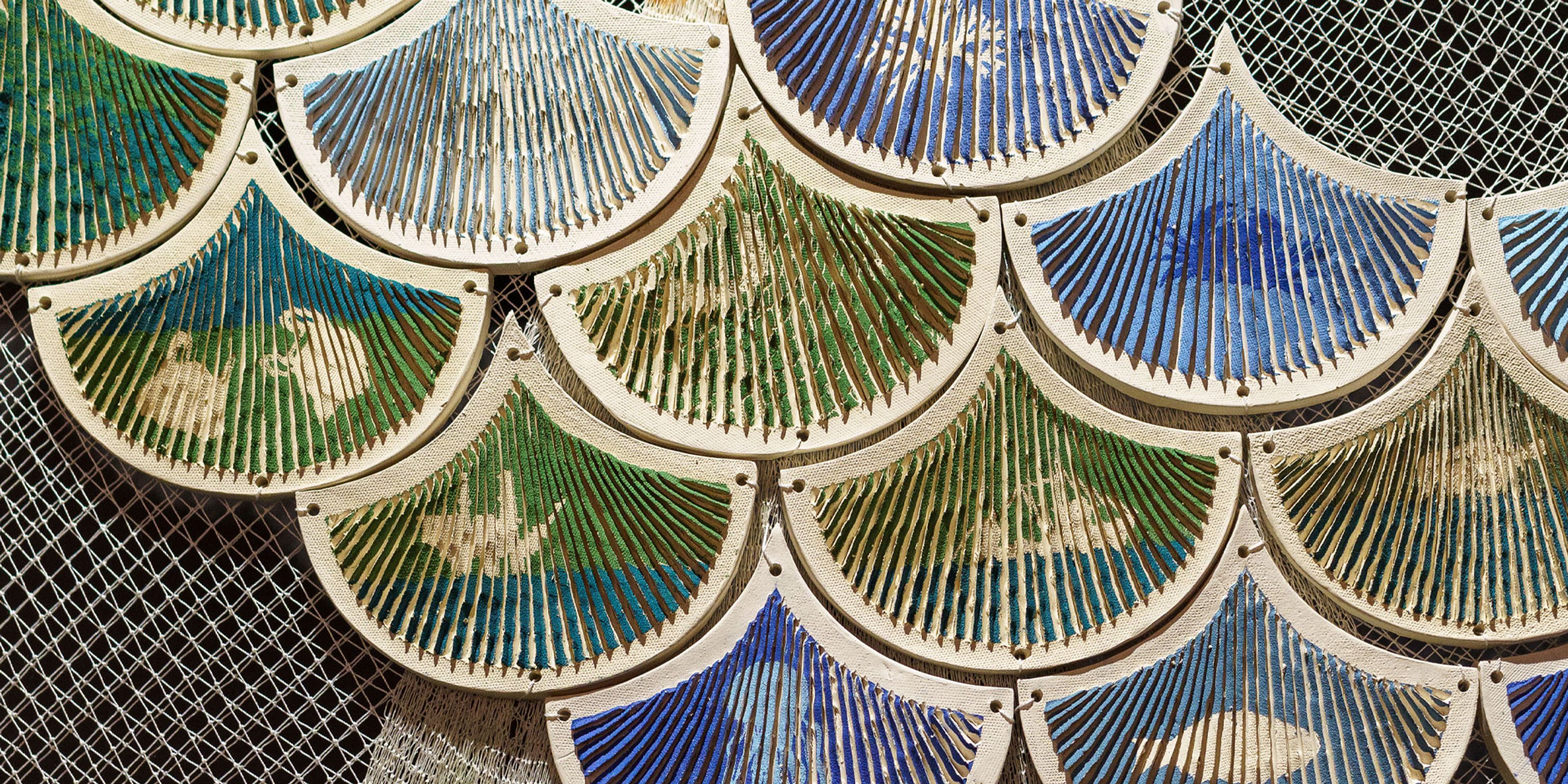 Close-up of decorative ceramic tiles arranged in a scalloped pattern.