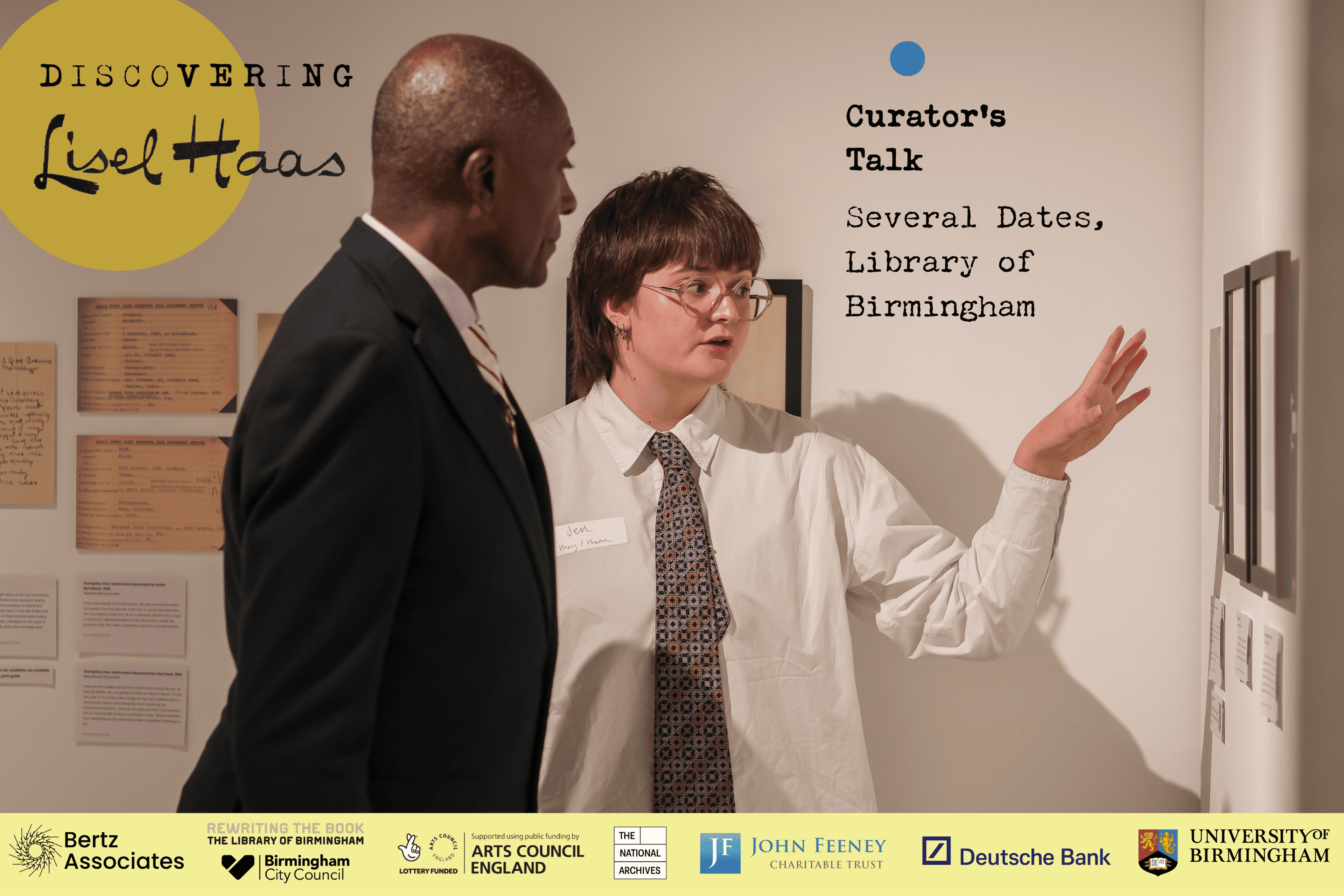 Curator's talk poster: features a photograph of Jen Wilbur showing a person round the exhibition. 