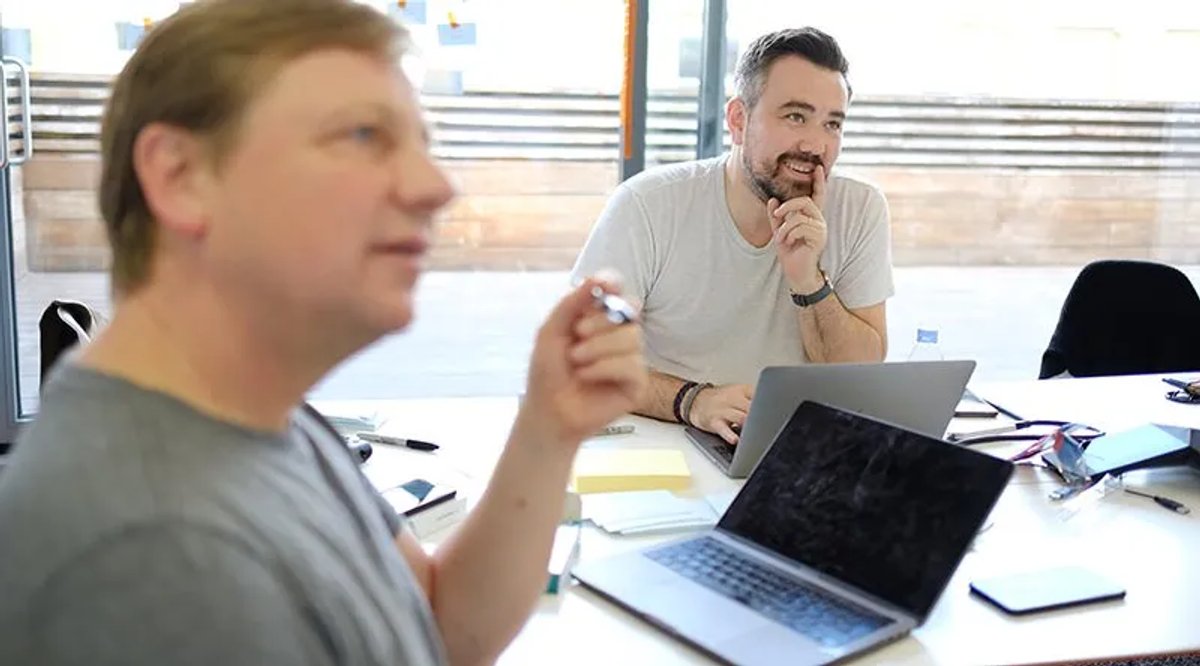 two-men-listening-in-meeting
