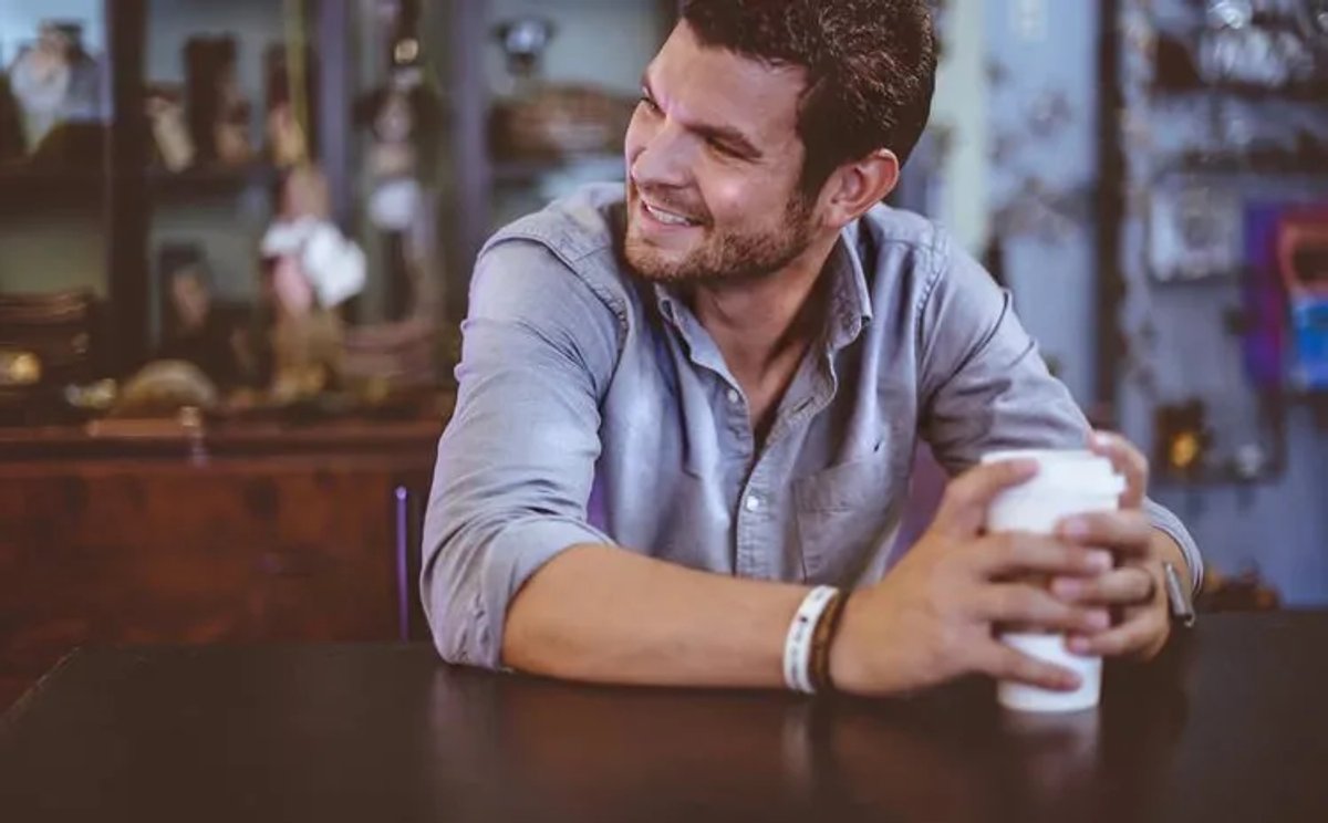 man-enjoying-coffee-smiling