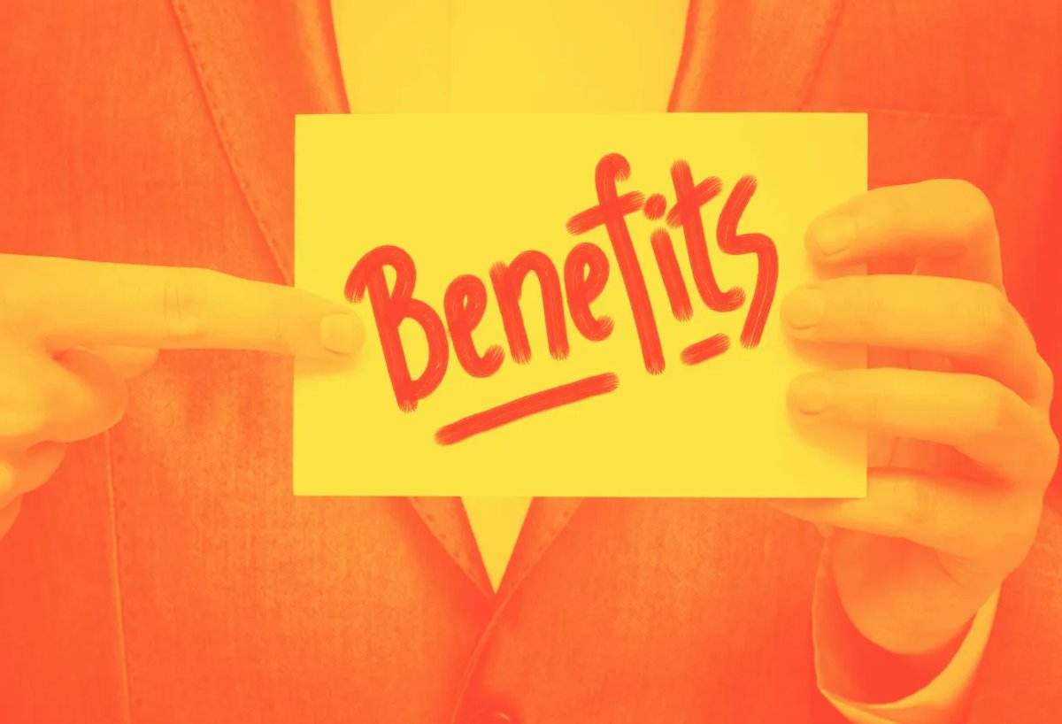 man in suit holding a card that says benefits cold email mistake guide