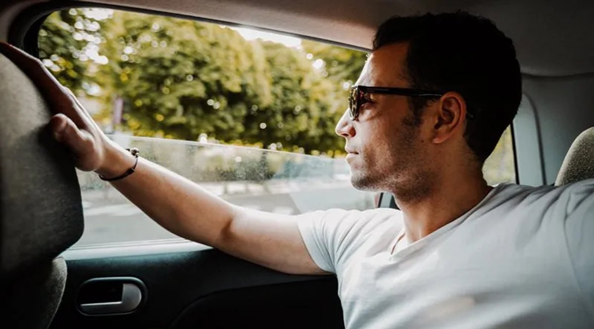 man-thinking-while-riding-in-car 